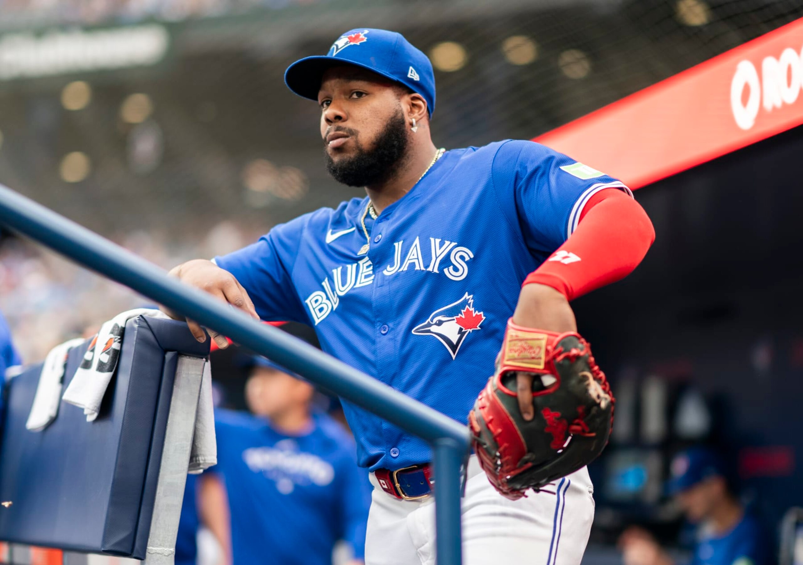 TORONTO, ON - JULY 2: Vladimir Guerrero Jr. #27 of Toronto Blue Jays looks on from the dugout before playing the Houston Astros in their MLB game at the Rogers Centre on July 2, 2024 in Toronto, Ontario, Canada. (Photo by Mark Blinch/Getty Images) TORONTO, ON - JULY 2: Vladimir Guerrero Jr. #27 of Toronto Blue Jays looks on from the dugout before playing the Houston Astros in their MLB game at the Rogers Centre on July 2, 2024 in Toronto, Ontario, Canada. (Photo by Mark Blinch/Getty Images)