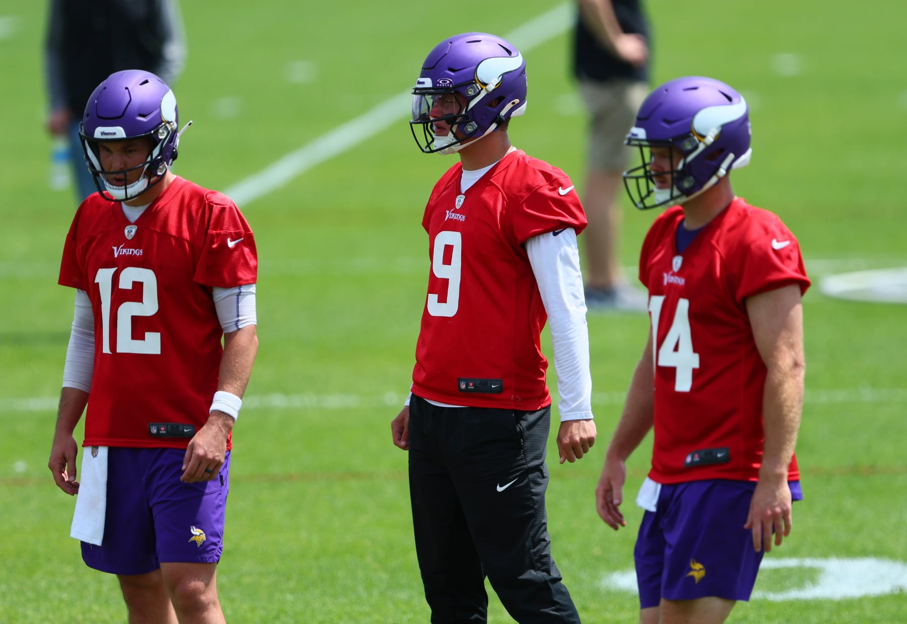 EAGAN, MINNESOTA - JUNE 04: (L-R) Quarterbacks Nick Mullens #12, J.J. McCarthy #9 and Sam Darnold #14 of the Minnesota Vikings practice during Minnesota Vikings mandatory minicamp at Twin Cities Orthopedics Performance Center on June 04, 2024 in Eagan, Minnesota.(Photo by Adam Bettcher/Getty Images)