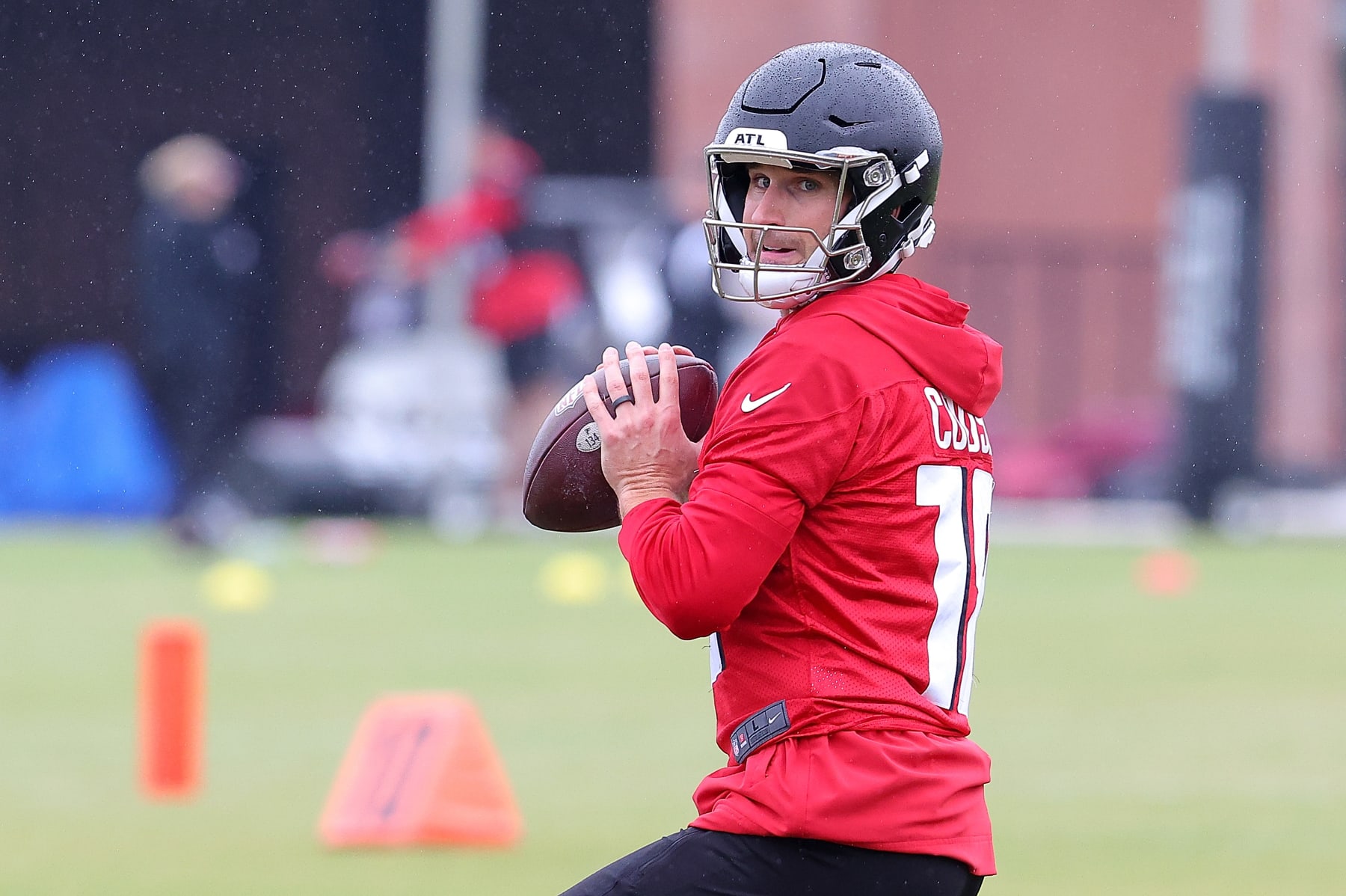 FLOWERY BRANCH, GEORGIA - MAY 14:  Quarterback Kirk Cousins #18 of the Atlanta Falcons looks to pass during OTA offseason workouts at the Atlanta Falcons training facility on May 14, 2024 in Flowery Branch, Georgia. (Photo by Kevin C. Cox/Getty Images)