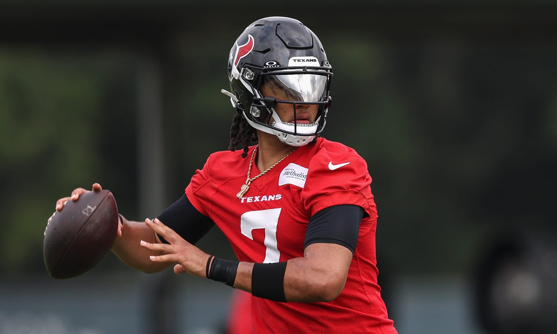 HOUSTON, TEXAS - JUNE 04: C.J. Stroud #7 of the Houston Texans looks to pass during Mandatory Minicamp at Houston Methodist Training Center on June 04, 2024 in Houston, Texas. (Photo by Tim Warner/Getty Images)
