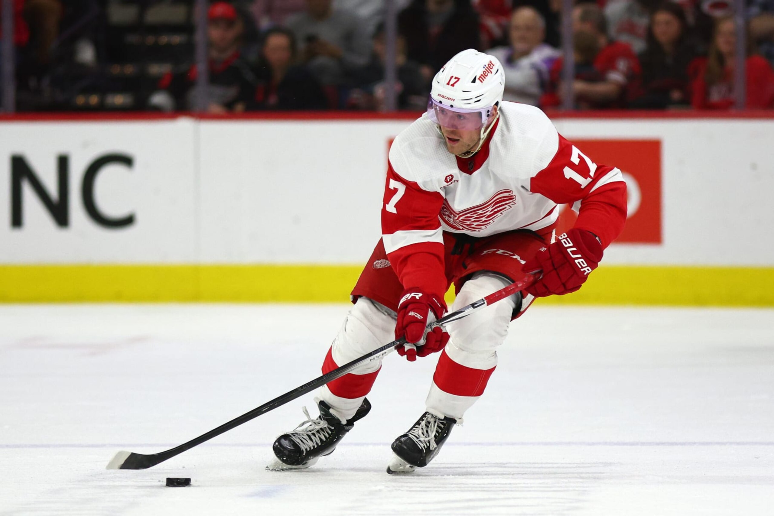 RALEIGH, NORTH CAROLINA - MARCH 28: Daniel Sprong #17 of the Detroit Red Wings skates with the puck during the first period of the game against the Carolina Hurricanes at PNC Arena on March 28, 2024 in Raleigh, North Carolina. (Photo by Jared C. Tilton/Getty Images)