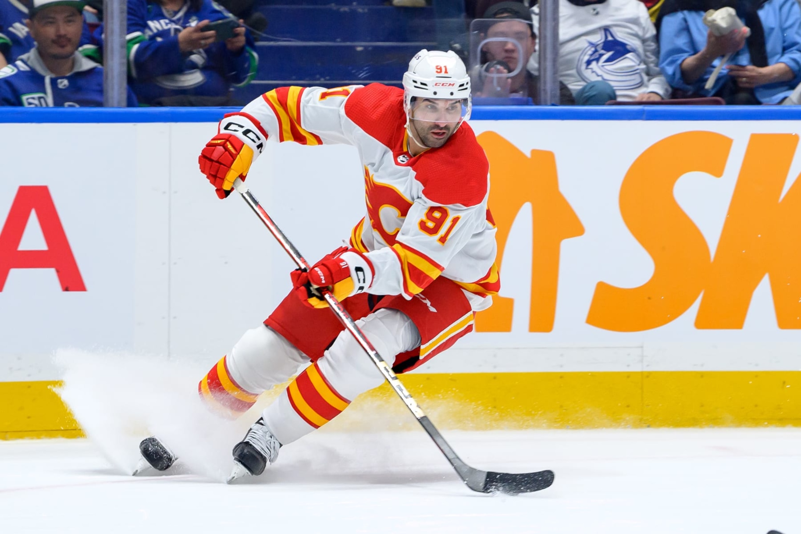 VANCOUVER, CANADA - APRIL 16: Nazem Kadri #91 of the Calgary Flames skates with the puck during the second period of their NHL game against the Vancouver Canucks at Rogers Arena on April 16, 2024 in Vancouver, British Columbia, Canada. (Photo by Derek Cain/Getty Images) VANCOUVER, CANADA - APRIL 16: Nazem Kadri #91 of the Calgary Flames skates with the puck during the second period of their NHL game against the Vancouver Canucks at Rogers Arena on April 16, 2024 in Vancouver, British Columbia, Canada. (Photo by Derek Cain/Getty Images)