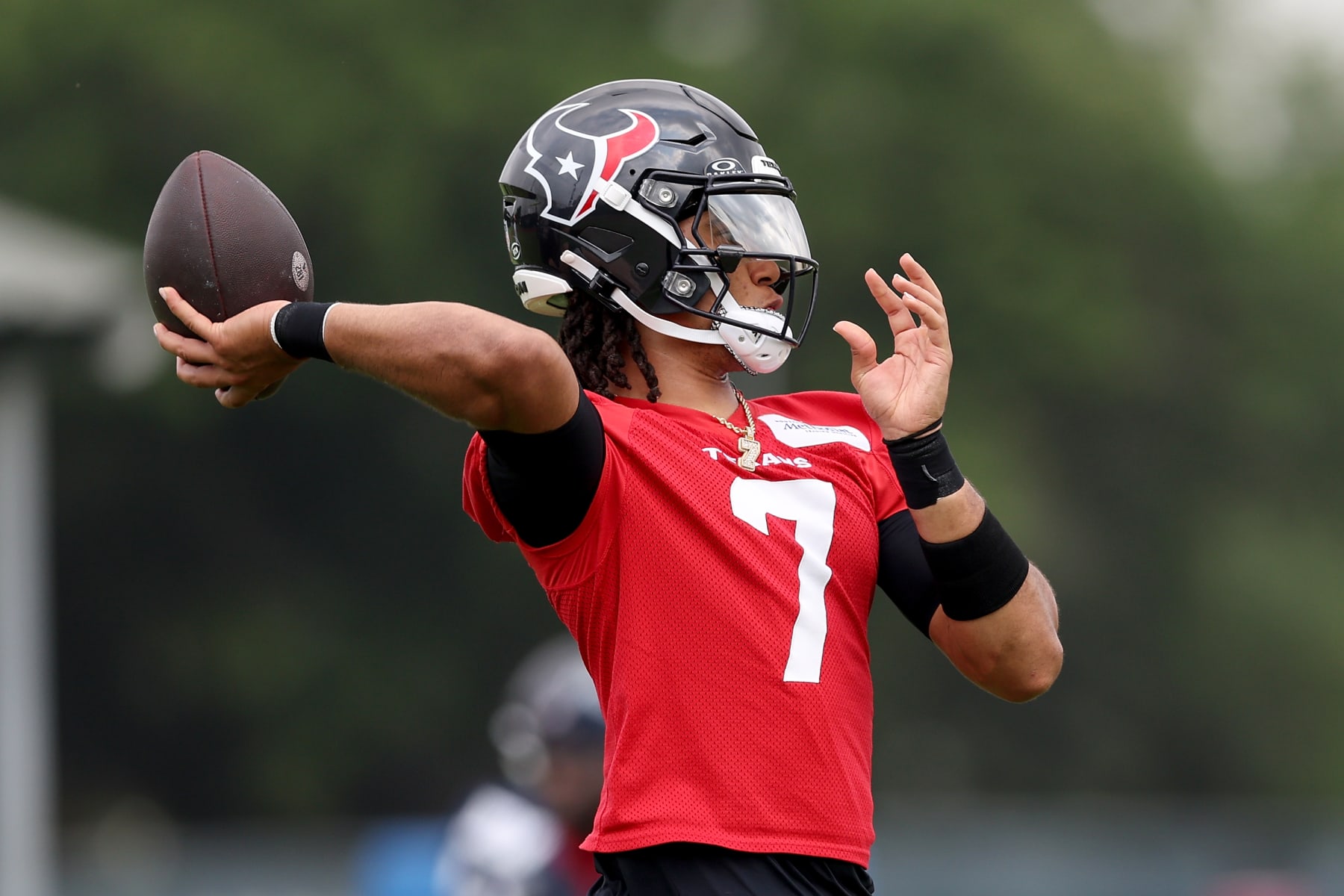 HOUSTON, TEXAS - JUNE 04: C.J. Stroud #7 of the Houston Texans throws a pass during Mandatory Minicamp at Houston Methodist Training Center on June 04, 2024 in Houston, Texas. (Photo by Tim Warner/Getty Images)