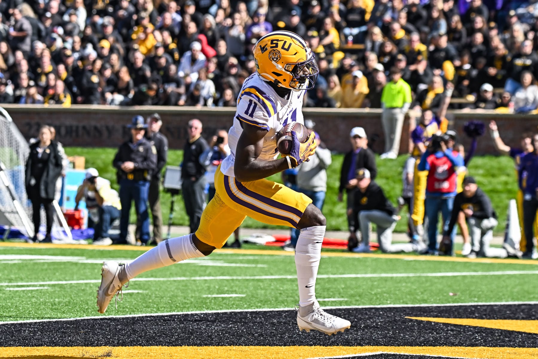 COLUMBIA, MO - OCTOBER 07: LSU Tigers wide receiver Brian Thomas Jr. (11) makes the catch in the end zone for a touchdown during a SEC conference game between the Louisiana State  Tigers and the Missouri Tigers held on Saturday Oct 07, 2023 at Faurot Field at Memorial Stadium in Columbia MO. (Photo by Rick Ulreich/Icon Sportswire via Getty Images