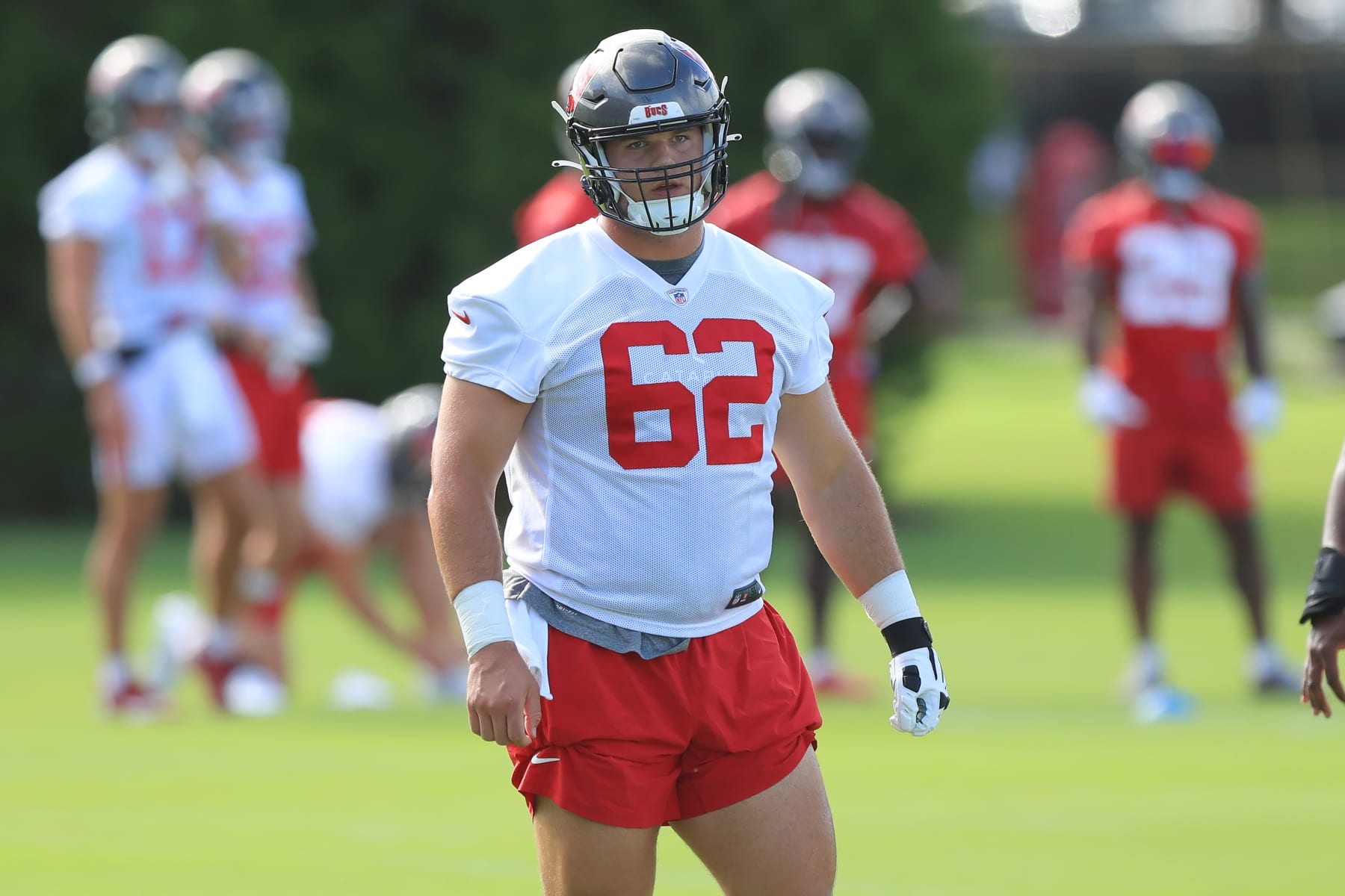 TAMPA, FL - JUN 12: Tampa Bay Buccaneers Center Graham Barton (62) goes thru a drill during the Tampa Bay Buccaneers Minicamp on June 12, 2024 at the AdventHealth Training Center at One Buccaneer Place in Tampa, Florida. (Photo by Cliff Welch/Icon Sportswire via Getty Images)