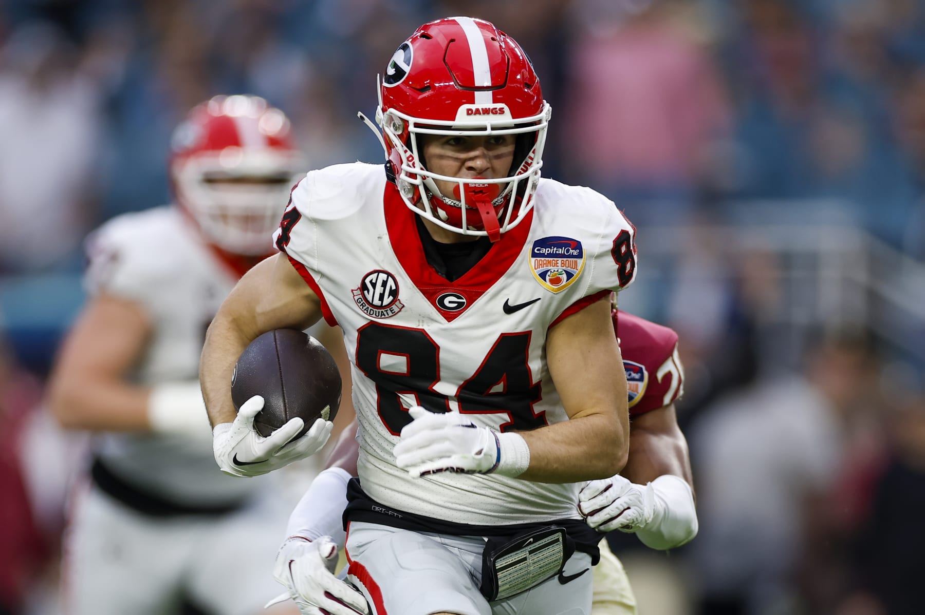 MIAMI GARDENS, FL - DECEMBER 30: Georgia Bulldogs wide receiver Ladd McConkey (84) runs with the ball after a catch during the game between the Georgia Bulldogs and the Florida State Seminoles on December 30, 2023 at Hard Rock Stadium in Miami Gardens, Fl.  (Photo by David Rosenblum/Icon Sportswire via Getty Images)