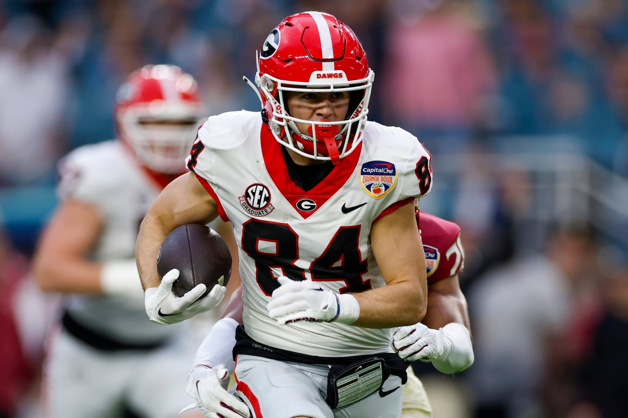MIAMI GARDENS, FL - DECEMBER 30: Georgia Bulldogs wide receiver Ladd McConkey (84) runs with the ball after a catch during the game between the Georgia Bulldogs and the Florida State Seminoles on December 30, 2023 at Hard Rock Stadium in Miami Gardens, Fl.  (Photo by David Rosenblum/Icon Sportswire via Getty Images)