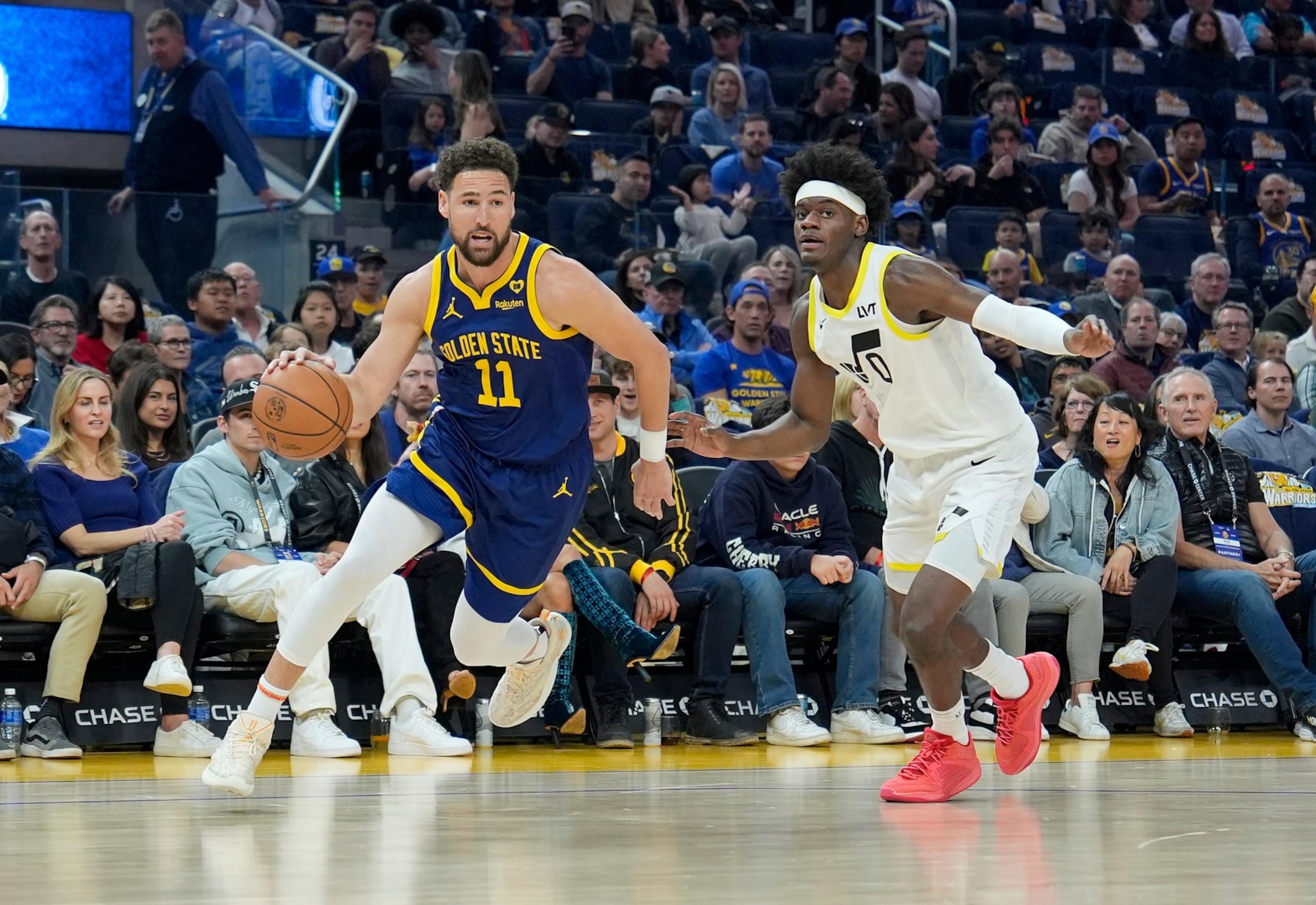 SAN FRANCISCO, CALIFORNIA - APRIL 07: Klay Thompson #11 of the Golden State Warriors drives towards the basket past Taylor Hendricks #0 of the Utah Jazz during first half of an NBA basketball game at Chase Center on April 07, 2024 in San Francisco, California. NOTE TO USER: User expressly acknowledges and agrees that, by downloading and or using this photograph, User is consenting to the terms and conditions of the Getty Images License Agreement. (Photo by Thearon W. Henderson/Getty Images)