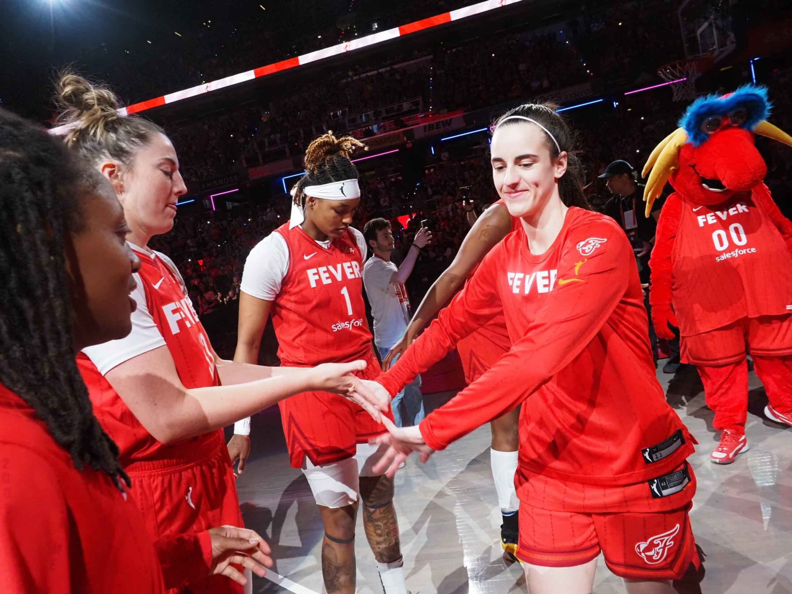 INDIANAPOLIS, IN - JULY 6: Caitlin Clark #22 of the Indiana Fever is introduced before the game against the New York Liberty on July 6, 2024 at Gainbridge Fieldhouse in Indianapolis, Indiana. NOTE TO USER: User expressly acknowledges and agrees that, by downloading and or using this Photograph, user is consenting to the terms and conditions of the Getty Images License Agreement. Mandatory Copyright Notice: Copyright 2024 NBAE (Photo by Ron Hoskins/NBAE via Getty Images)
