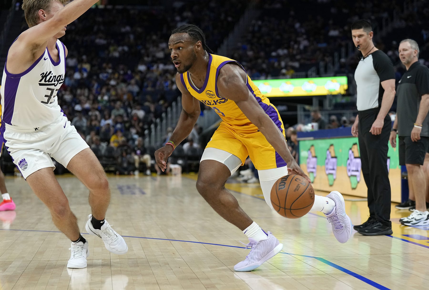 SAN FRANCISCO, CALIFORNIA - JULY 06: Bronny James Jr. #9 of the Los Angeles Lakers drives to the basket on Dane Goodwin #33 of the Sacramento Kings during the second half of a 2024 California Classic summer league game at Chase Center on July 06, 2024 in San Francisco, California. NOTE TO USER: User expressly acknowledges and agrees that, by downloading and or using this photograph, User is consenting to the terms and conditions of the Getty Images License Agreement. (Photo by Thearon W. Henderson/Getty Images)