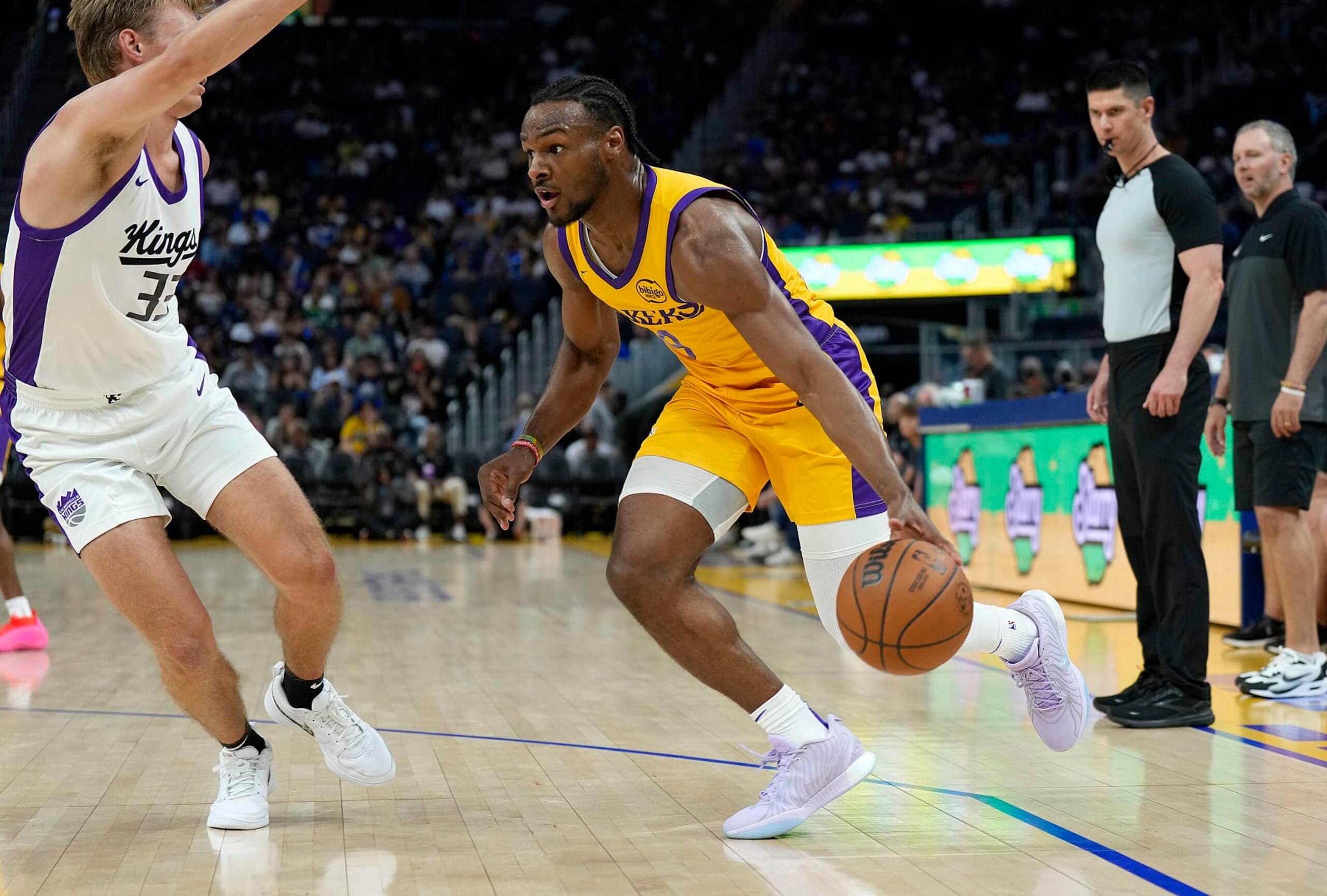 SAN FRANCISCO, CALIFORNIA - JULY 06: Bronny James Jr. #9 of the Los Angeles Lakers drives to the basket on Dane Goodwin #33 of the Sacramento Kings during the second half of a 2024 California Classic summer league game at Chase Center on July 06, 2024 in San Francisco, California. NOTE TO USER: User expressly acknowledges and agrees that, by downloading and or using this photograph, User is consenting to the terms and conditions of the Getty Images License Agreement. (Photo by Thearon W. Henderson/Getty Images)