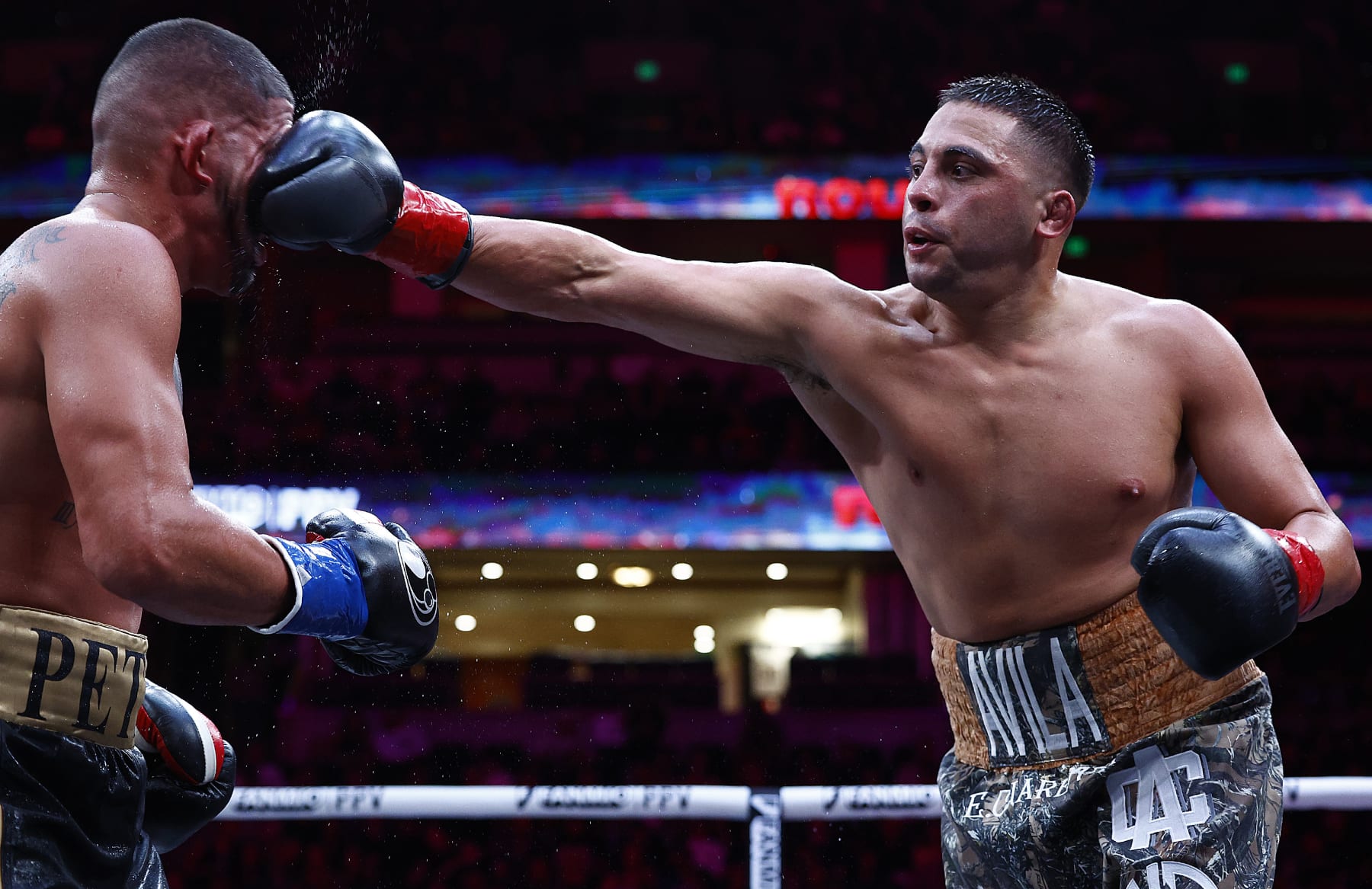 ANAHEIM, CALIFORNIA - JULY 06: Chris Avila lands a punch against Anthony Pettis during round si of their cruiserweights fight at Honda Center on July 06, 2024 in Anaheim, California. (Photo by Ronald Martinez/Getty Images)
