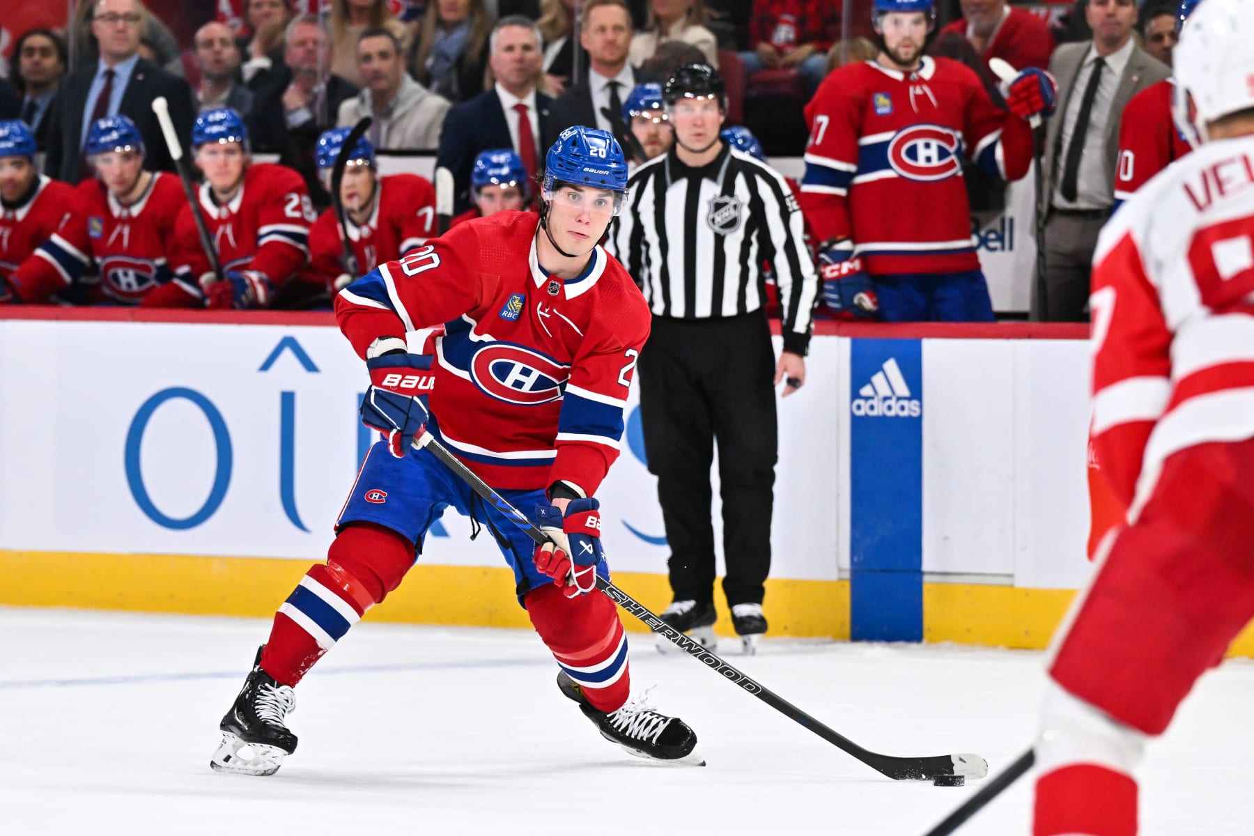 MONTREAL, CANADA - APRIL 16:  Juraj Slafkovsky #20 of the Montreal Canadiens skates the puck during the second period against the Detroit Red Wings at the Bell Centre on April 16, 2024 in Montreal, Quebec, Canada.  The Detroit Red Wings defeated the Montreal Canadiens 5-4 in a shootout.  (Photo by Minas Panagiotakis/Getty Images)