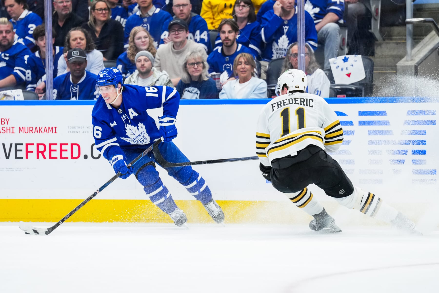 TORONTO, ON - MAY 2: Mitch Marner #16 of the Toronto Maple Leafs skates against Trent Frederic #11 of the Boston Bruins during the first period in Game Six of the First Round of the 2024 Stanley Cup Playoffs at Scotiabank Arena on May 2, 2024 in Toronto, Ontario, Canada. (Photo by Kevin Sousa/NHLI via Getty Images)