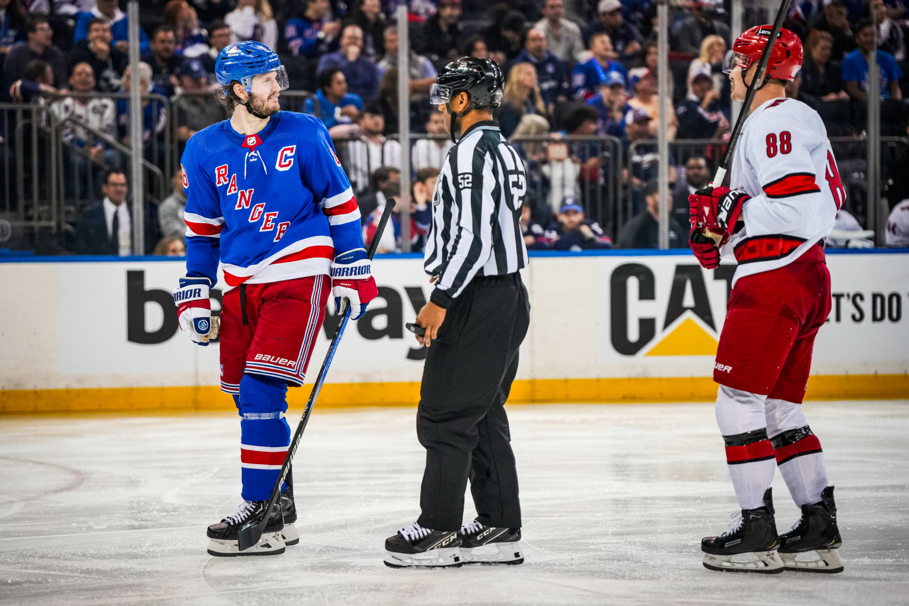New York Rangers captain Jacob Trouba (left) and Carolina Hurricanes winger Martin NeÄas (right). 
