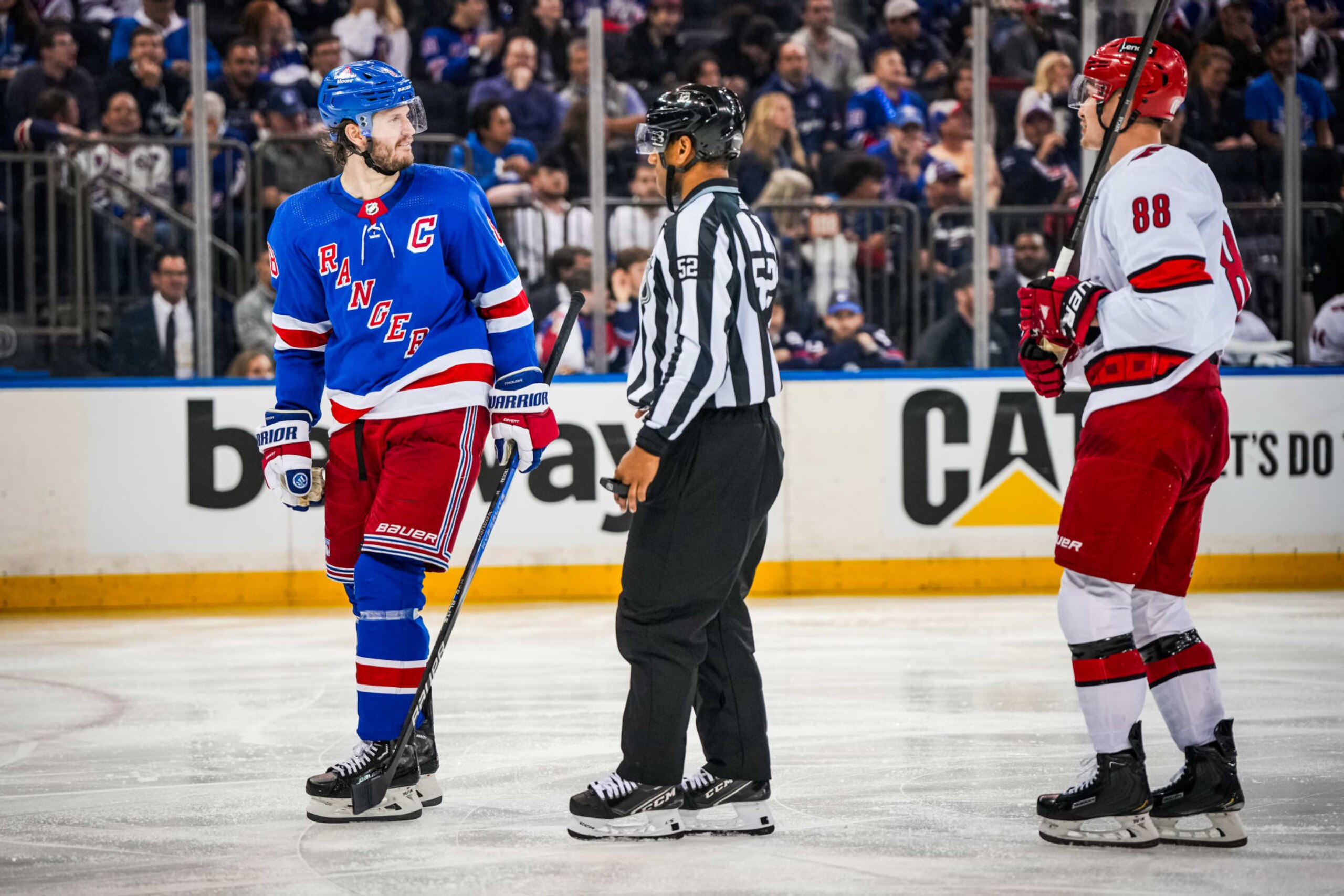 New York Rangers captain Jacob Trouba (left) and Carolina Hurricanes winger Martin NeÄas (right). 