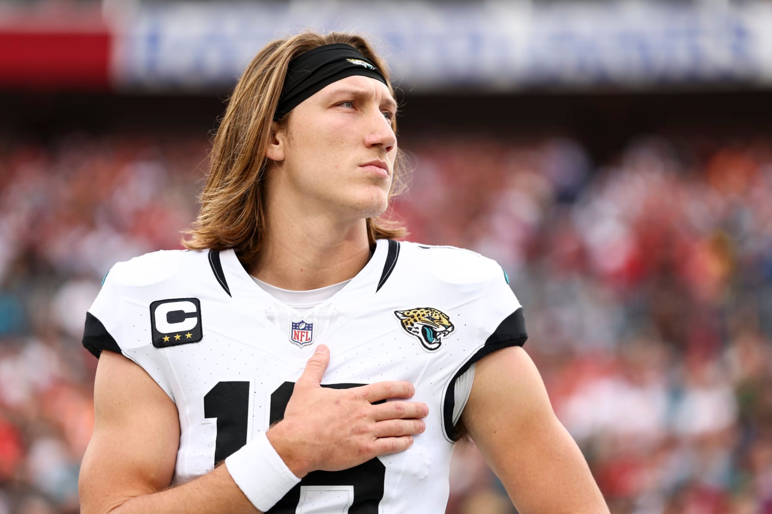 TAMPA, FL - DECEMBER 24: Trevor Lawrence #16 of the Jacksonville Jaguars stands on the sidelines during the national anthem prior to an NFL football game against the Tampa Bay Buccaneers at Raymond James Stadium on December 24, 2023 in Tampa, Florida. (Photo by Kevin Sabitus/Getty Images) TAMPA, FL - DECEMBER 24: Trevor Lawrence #16 of the Jacksonville Jaguars stands on the sidelines during the national anthem prior to an NFL football game against the Tampa Bay Buccaneers at Raymond James Stadium on December 24, 2023 in Tampa, Florida. (Photo by Kevin Sabitus/Getty Images)