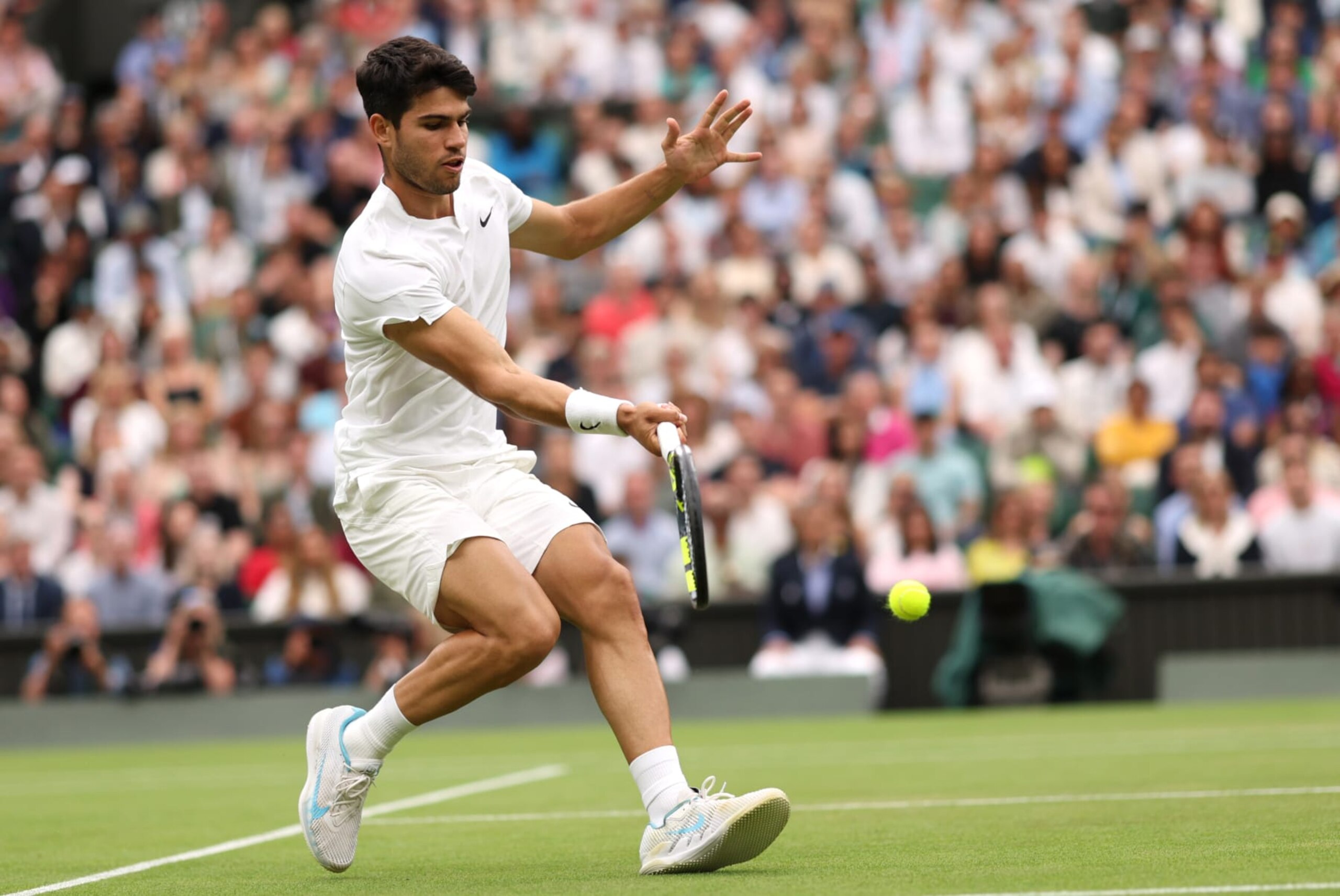 LONDON, ENGLAND - JULY 07: Carlos Alcaraz of Spain plays a forehand against Ugo Humbert of France in his Gentleman's Singles fourth round match during day seven of The Championships Wimbledon 2024 at All England Lawn Tennis and Croquet Club on July 07, 2024 in London, England. (Photo by Clive Brunskill/Getty Images) LONDON, ENGLAND - JULY 07: Carlos Alcaraz of Spain plays a forehand against Ugo Humbert of France in his Gentleman's Singles fourth round match during day seven of The Championships Wimbledon 2024 at All England Lawn Tennis and Croquet Club on July 07, 2024 in London, England. (Photo by Clive Brunskill/Getty Images)