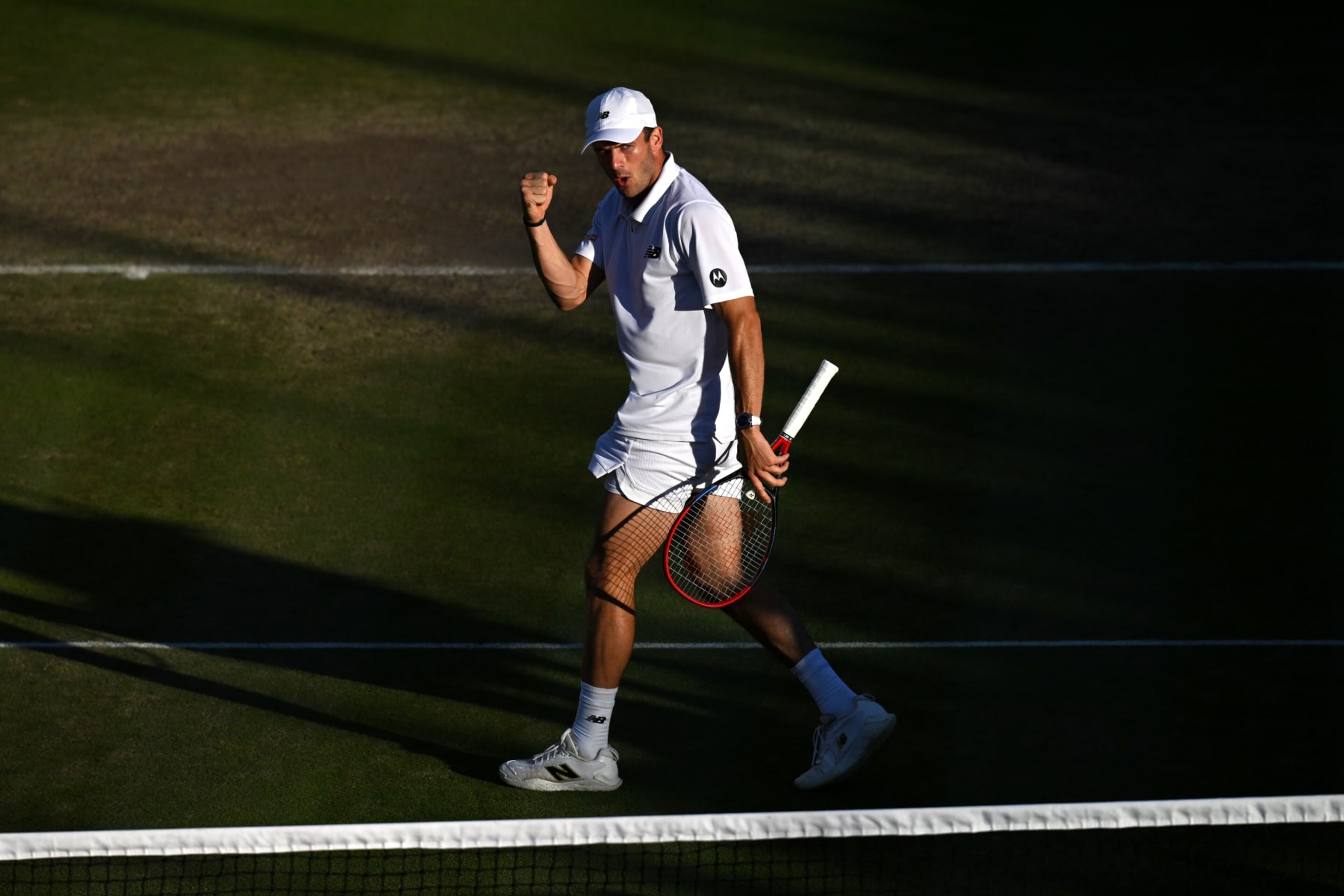 LONDON, ENGLAND - JULY 07: Tommy Paul of United States celebrates a point against Roberto Bautista Agut of Spain in his Gentlemen's Singles fourth round match during day seven of The Championships Wimbledon 2024 at All England Lawn Tennis and Croquet Club on July 07, 2024 in London, England. (Photo by Mike Hewitt/Getty Images)