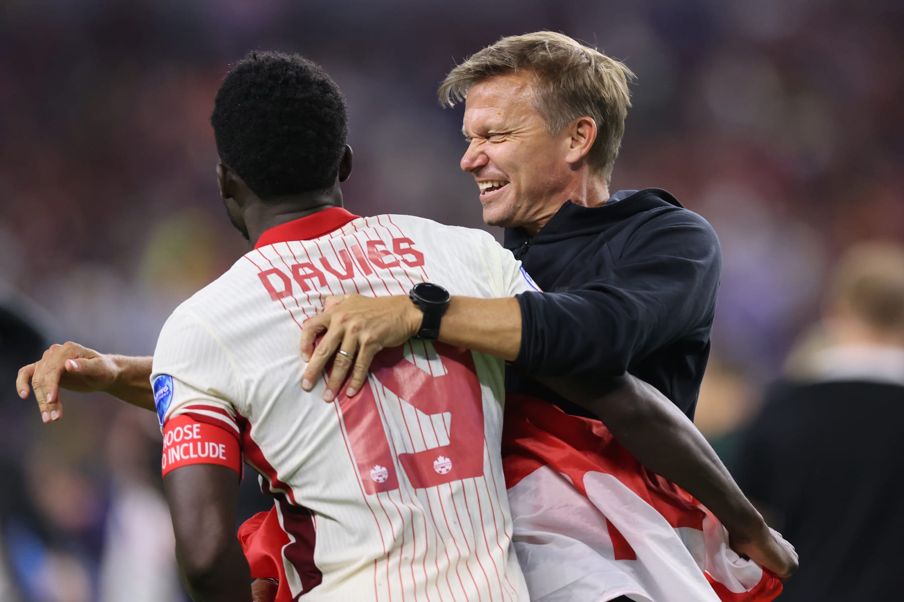 ARLINGTON, TEXAS - JULY 05: Alphonso Davies of Canada celebrates with Jesse Marsch, Head Coach of Canada after the CONMEBOL Copa America 2024 quarter-final match between Venezuela and Canada at AT&T Stadium on July 05, 2024 in Arlington, Texas. (Photo by Ron Jenkins/Getty Images)