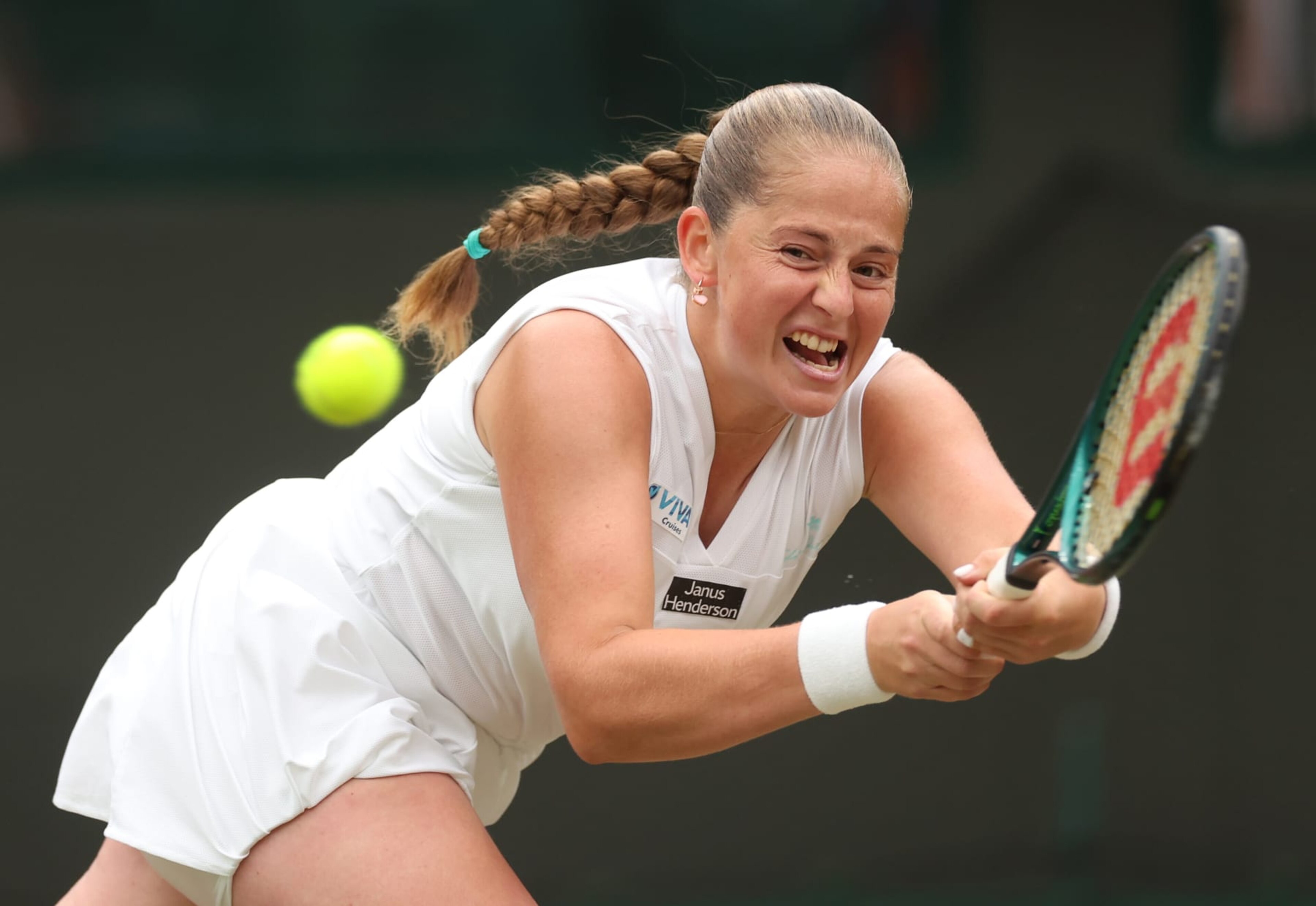 LONDON, ENGLAND - JULY 08: Jelena Ostapenko of Latvia plays a backhand against Yulia Putintseva of Kazakhstan in the Ladies' Singles fourth round match during day eight of The Championships Wimbledon 2024 at All England Lawn Tennis and Croquet Club on July 08, 2024 in London, England. (Photo by Sean M. Haffey/Getty Images) LONDON, ENGLAND - JULY 08: Jelena Ostapenko of Latvia plays a backhand against Yulia Putintseva of Kazakhstan in the Ladies' Singles fourth round match during day eight of The Championships Wimbledon 2024 at All England Lawn Tennis and Croquet Club on July 08, 2024 in London, England. (Photo by Sean M. Haffey/Getty Images)