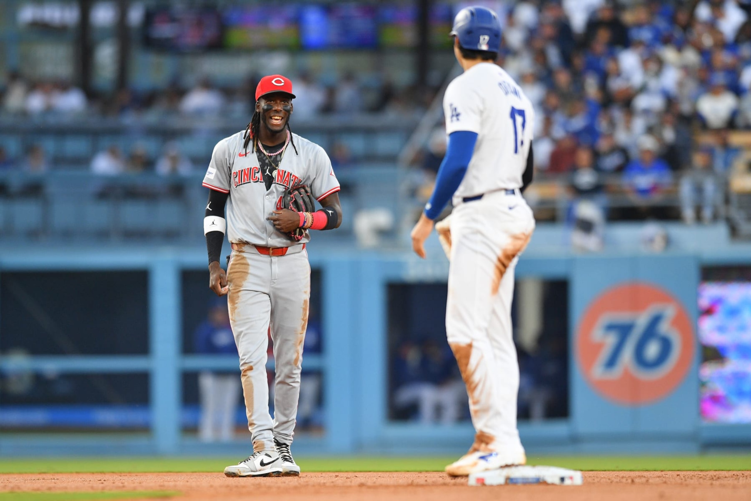 LOS ANGELES, CA - MAY 16: Cincinnati Reds shortstop Elly De La Cruz (44) jokes with Los Angeles Dodgers designated hitter Shohei Ohtani (17) during the MLB game between the Cincinnati Reds and the Los Angeles Dodgers on May 16, 2024 at Dodger Stadium in Los Angeles, CA. (Photo by Brian Rothmuller/Icon Sportswire via Getty Images)