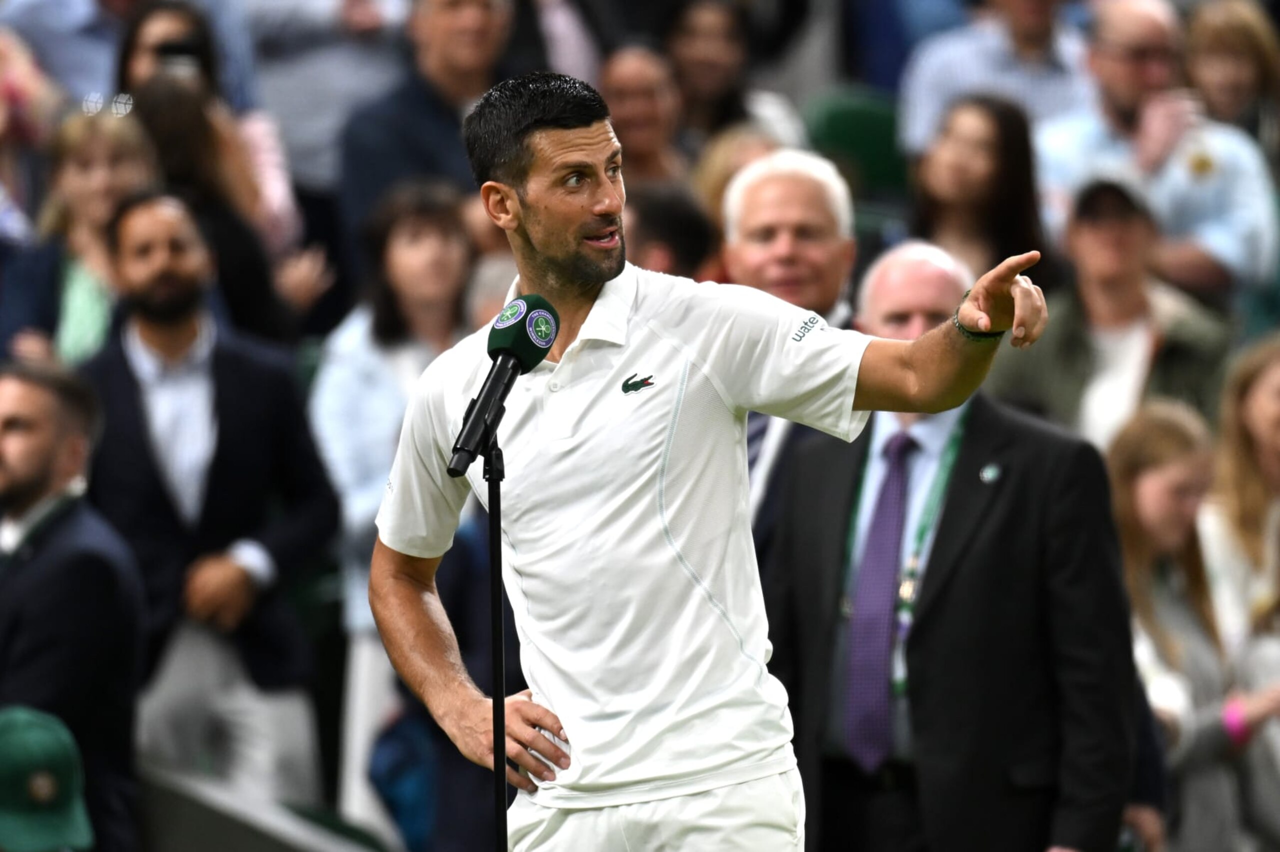 LONDON, ENGLAND - JULY 08: Novak Djokovic of Serbia addresses the crowd on Centre Court wishing them a 'good night' following victory against Holger Rune of Denmark in his Gentlemen's Singles fourth round match during day eight of The Championships Wimbledon 2024 at All England Lawn Tennis and Croquet Club on July 08, 2024 in London, England. (Photo by Mike Hewitt/Getty Images)