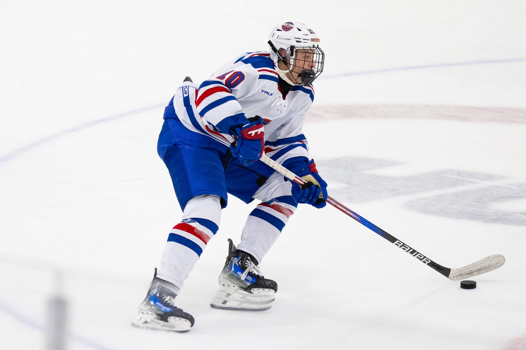 PLYMOUTH, MI - JANUARY 15: James Hagens #10 of Team White skates with the puck during Chipotle All-American Game between Team Blue and Team White at USA Hockey Arena on January 15, 2024 in Plymouth, Michigan. (Photo by Michael Miller/ISI Photos/Getty Images)