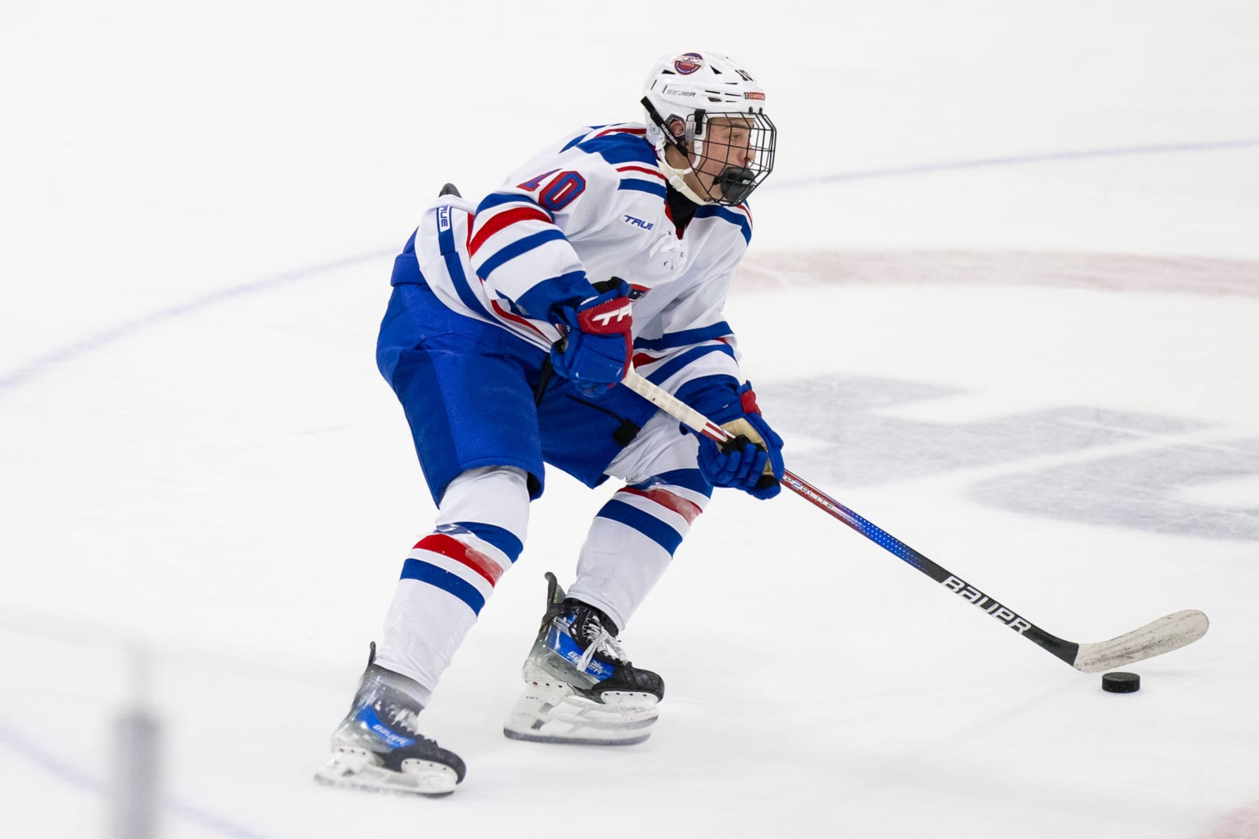 PLYMOUTH, MI - JANUARY 15: James Hagens #10 of Team White skates with the puck during Chipotle All-American Game between Team Blue and Team White at USA Hockey Arena on January 15, 2024 in Plymouth, Michigan. (Photo by Michael Miller/ISI Photos/Getty Images)