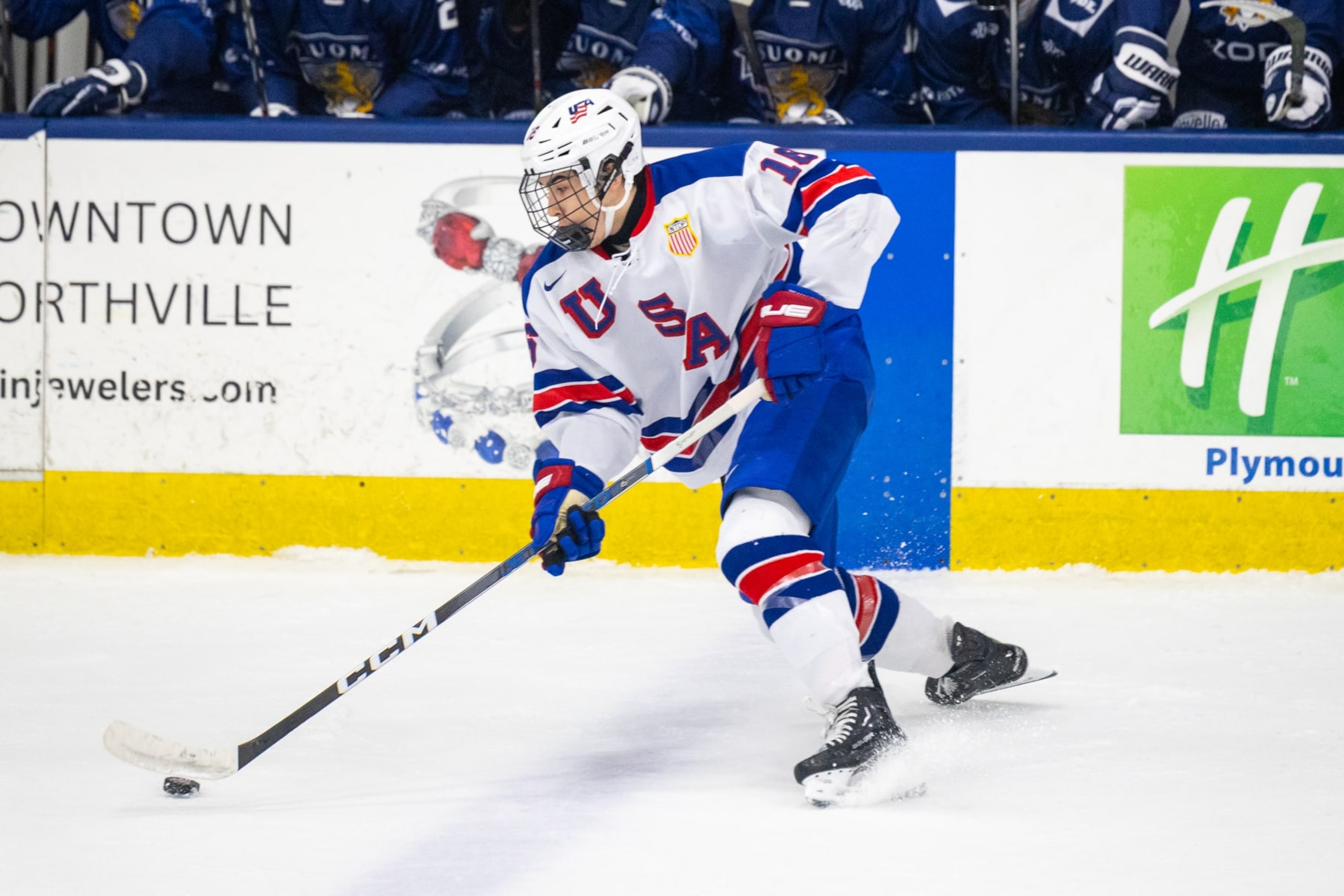 PLYMOUTH, MI - FEBRUARY 7: Logan Hensler #16 of Team USA stops with the puck during U18 Five Nations Tournament between Team Finland and Team USA at USA Hockey Arena on February 7, 2024 in Plymouth, Michigan. (Photo by Michael Miller/ISI Photos/Getty Images)