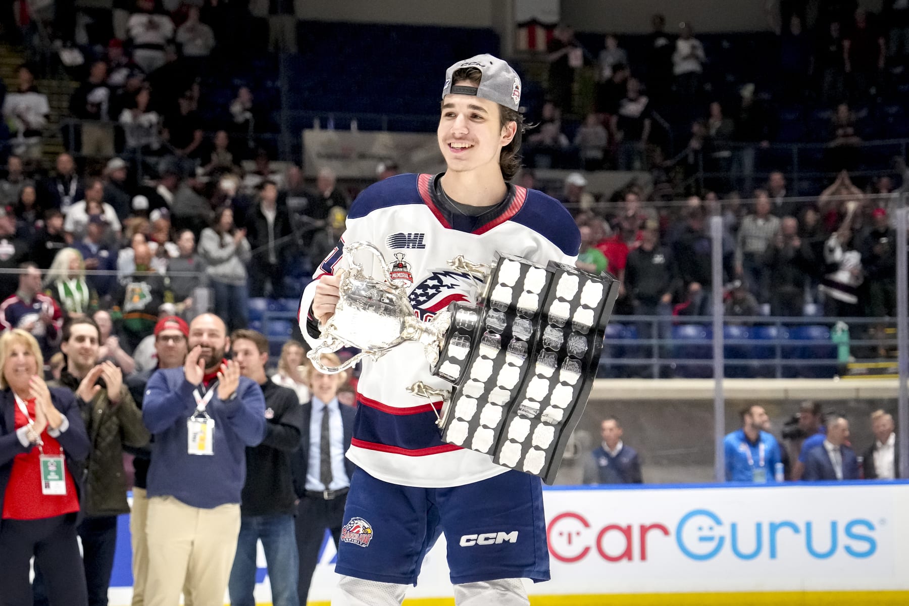 SAGINAW, MICHIGAN - JUNE 02: Michael Misa #77 of the Saginaw Spirit celebrates with the Memorial Cup after defeating the London Knights in the 2024 Memorial Cup Final at Dow Event Center on June 02, 2024 in Saginaw, Michigan. (Photo by Nic Antaya/Getty Images)