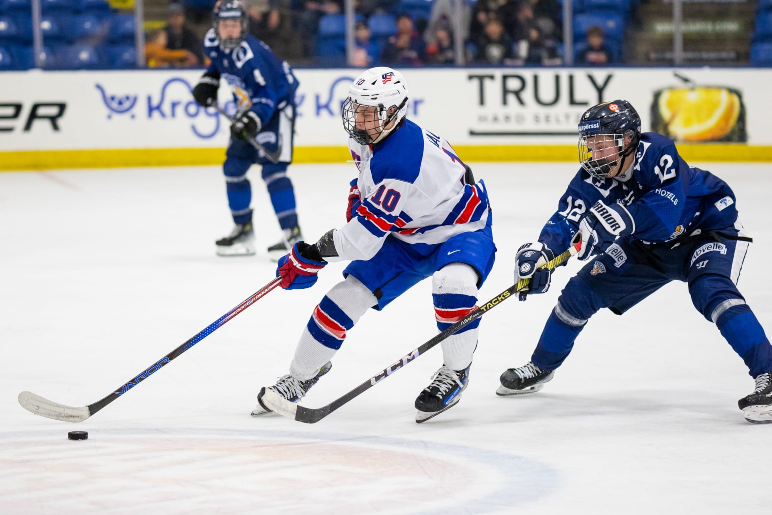 PLYMOUTH, MI - FEBRUARY 7: James Hagens #10 of Team USA shields the puck from Aatos Koivu #12 of Team Finland during U18 Five Nations Tournament between Team Finland and Team USA at USA Hockey Arena on February 7, 2024 in Plymouth, Michigan. (Photo by Michael Miller/ISI Photos/Getty Images)