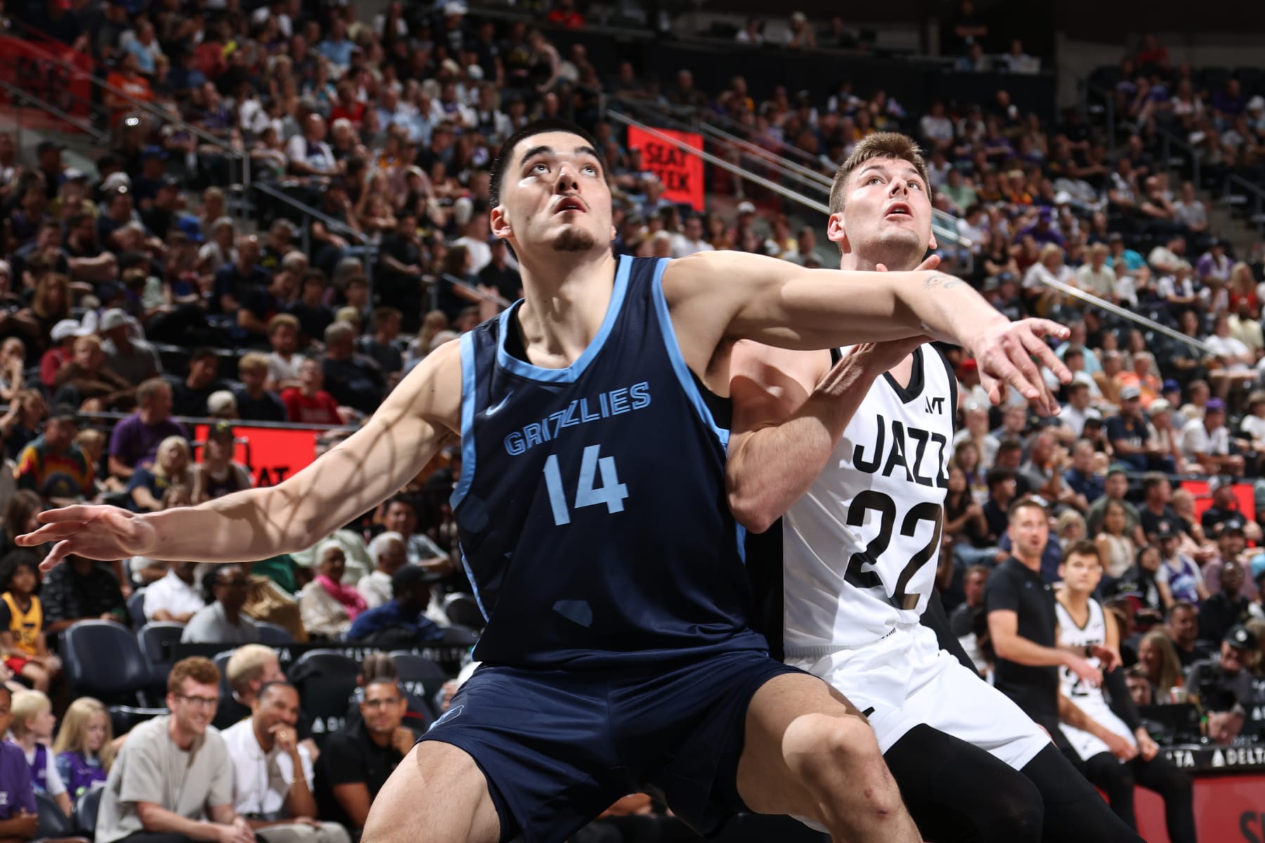 SALT LAKE CITY, UT - July 8: Zach Edey #14 of the Memphis Grizzlies and Kyle Filipowski #22 of the Utah Jazz battle for position during the 2024 NBA Salt Lake City Summer League on July 8, 2024 at Delta Center in Salt Lake City, Utah. NOTE TO USER: User expressly acknowledges and agrees that, by downloading and or using this Photograph, User is consenting to the terms and conditions of the Getty Images License Agreement. Mandatory Copyright Notice: Copyright 2024 NBAE (Photo by Melissa Majchrzak/NBAE via Getty Images)