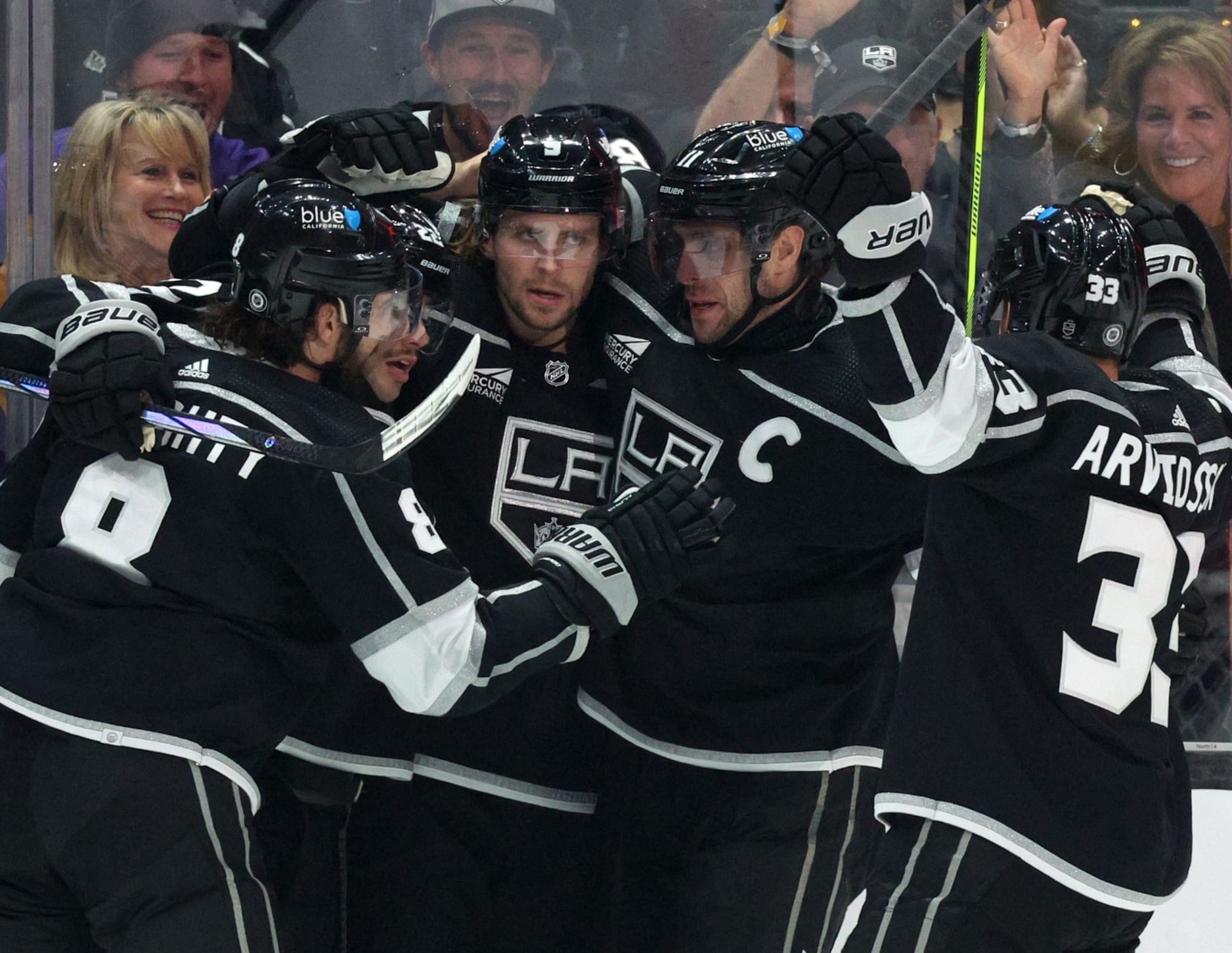LOS ANGELES, CALIFORNIA - APRIL 06: Adrian Kempe #9 of the Los Angeles Kings celebrates his goal with Drew Doughty #8, Kevin Fiala #22, Anze Kopitar #11 and Viktor Arvidsson #33, to take a 1-0 lead over the Vancouver Canucks, during the first period at Crypto.com Arena on April 06, 2024 in Los Angeles, California. (Photo by Harry How/Getty Images)