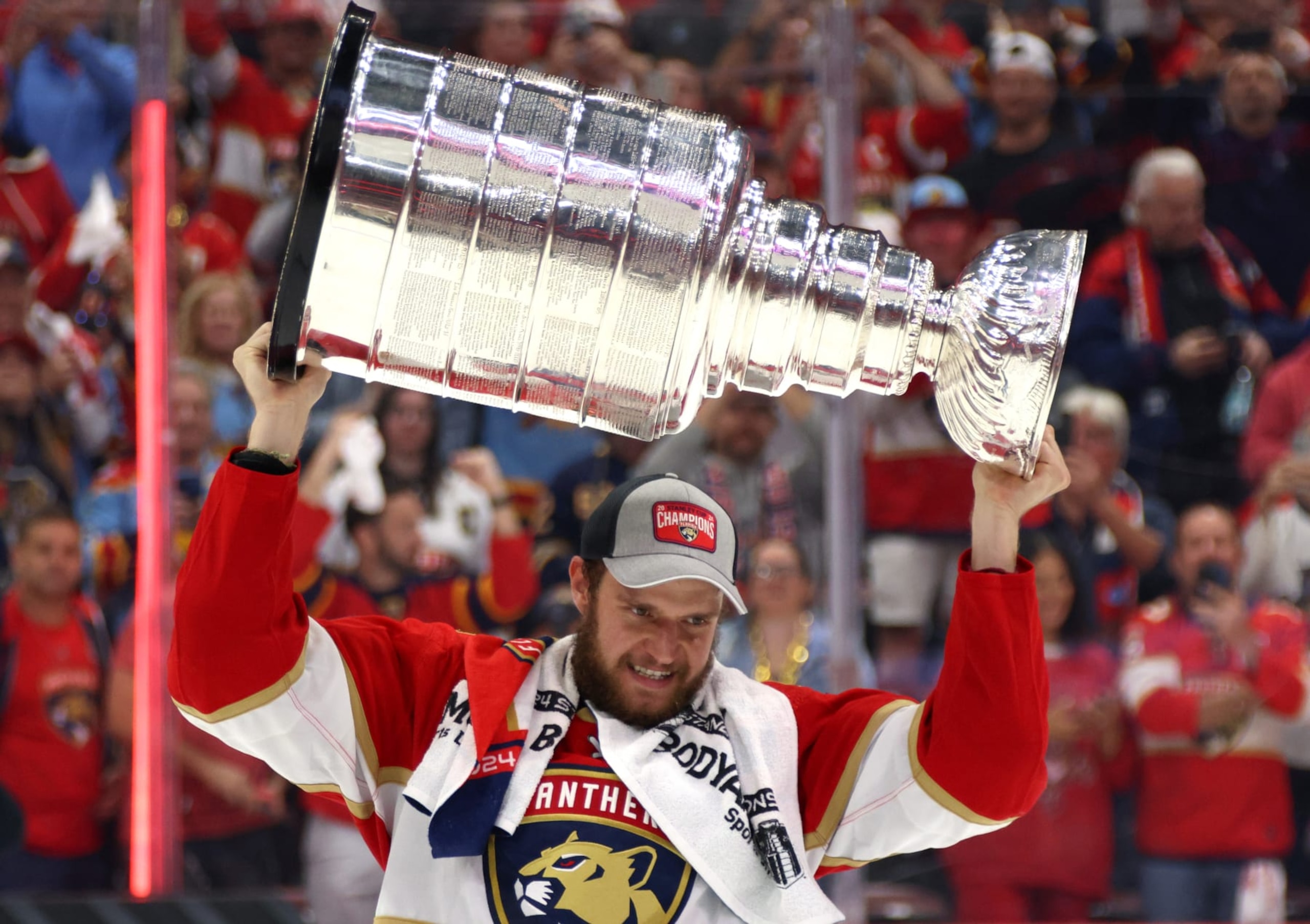SUNRISE, FLORIDA - JUNE 24: Aleksander Barkov #16 of the Florida Panthers lifts the Stanley Cup after Game Seven of the 2024 Stanley Cup Final between the Edmonton Oilers and the Florida Panthers at Amerant Bank Arena on June 24, 2024 in Sunrise, Florida. (Photo by Dave Sandford/NHLI via Getty Images)