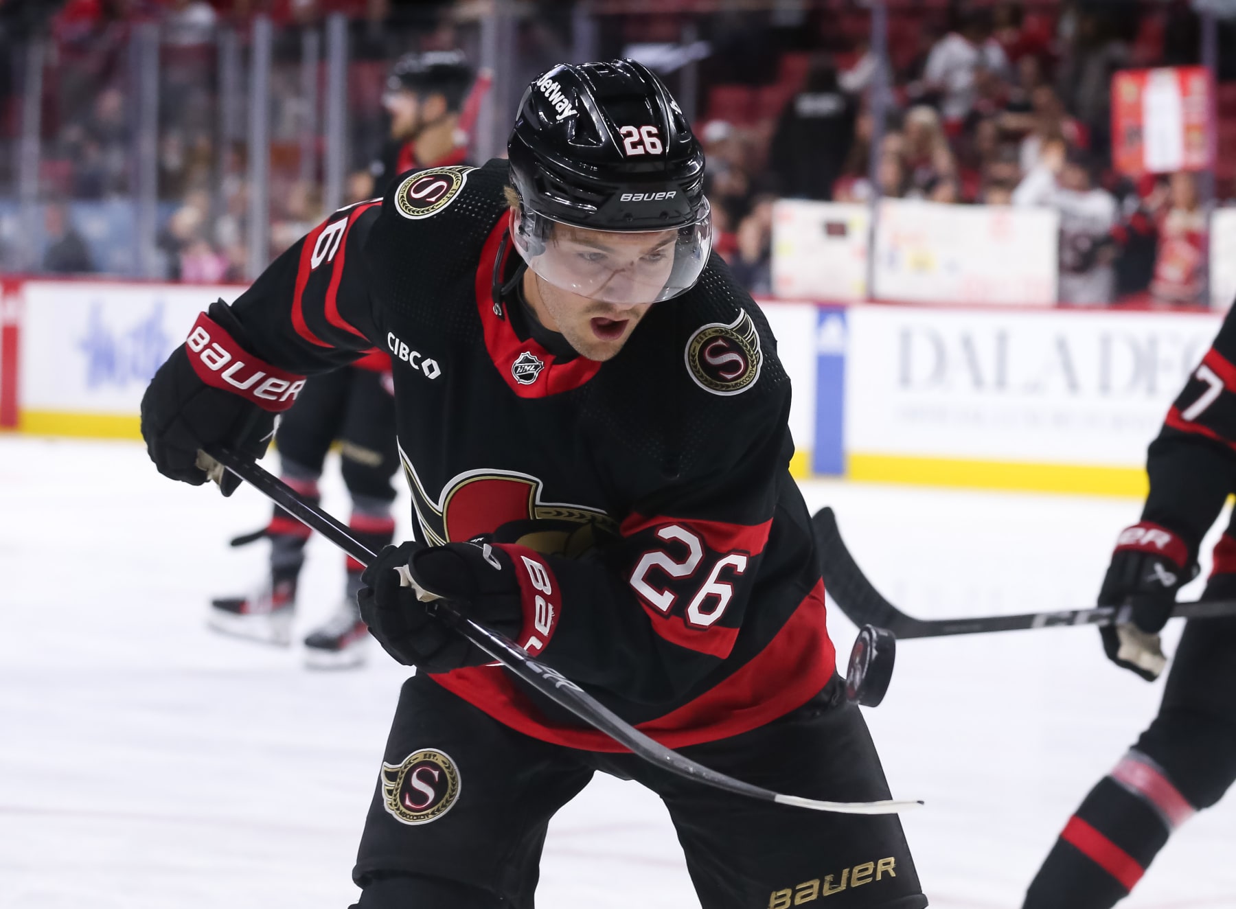 OTTAWA, CANADA - APRIL 13: Erik Brannstrom #26 of the Ottawa Senators juggles the puck during warm ups prior to a game against the Montreal Canadiens at Canadian Tire Centre on April 13, 2024 in Ottawa, Ontario, Canada. (Photo by Chris Tanouye/Freestyle Photography/Getty Images)