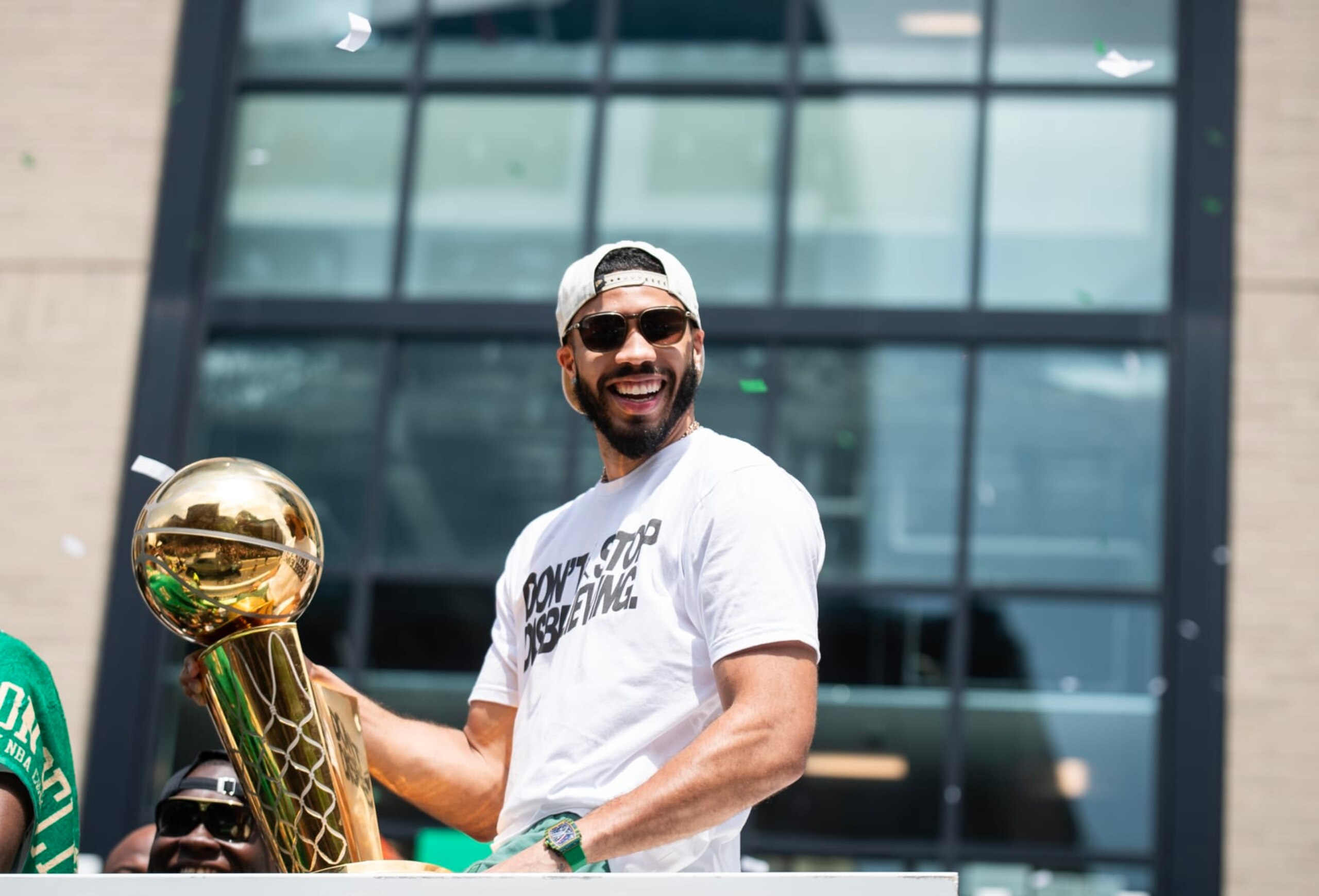 BOSTON, MA - JUNE 21: Jayson Tatum #0 of the Boston Celtics celebrates with the Larry O'Brien Trophy during the 2024 Boston Celtics championship parade on June 21, 2024 in Boston, Massachusetts. NOTE TO USER: User expressly acknowledges and agrees that, by downloading and or using this photograph, User is consenting to the terms and conditions of the Getty Images License Agreement. Mandatory Copyright Notice: Copyright 2024 NBAE  (Photo by China Wong/NBAE via Getty Images)