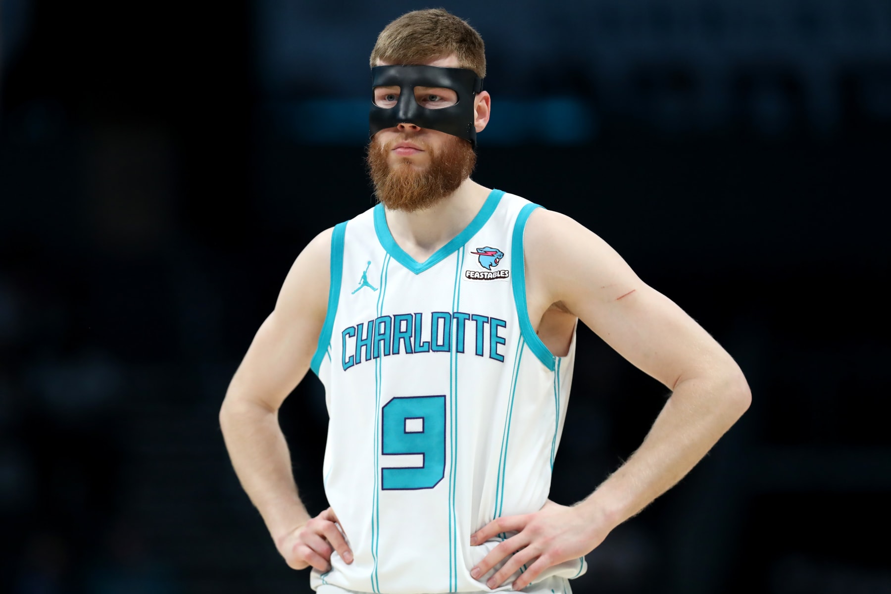 CHARLOTTE, NORTH CAROLINA - APRIL 03: Davis Bertans #9 of the Charlotte Hornets looks on during the first half against the Portland Trail Blazers at Spectrum Center on April 03, 2024 in Charlotte, North Carolina. NOTE TO USER: User expressly acknowledges and agrees that, by downloading and or using this photograph, User is consenting to the terms and conditions of the Getty Images License Agreement. (Photo by David Jensen/Getty Images)