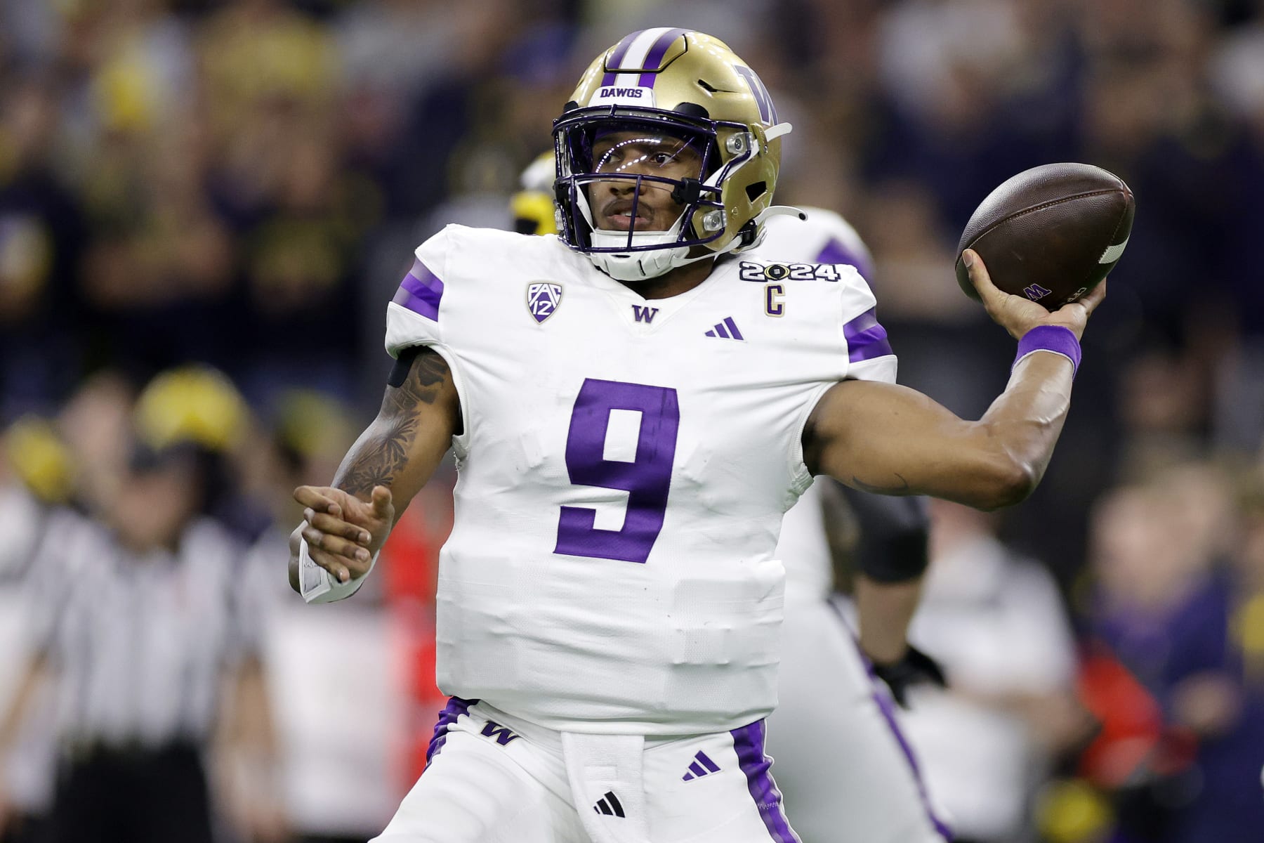 HOUSTON, TEXAS - JANUARY 08: Michael Penix Jr. #9 of the Washington Huskies throws the ball in the third quarter against the Michigan Wolverines during the 2024 CFP National Championship game at NRG Stadium on January 08, 2024 in Houston, Texas. (Photo by Carmen Mandato/Getty Images)