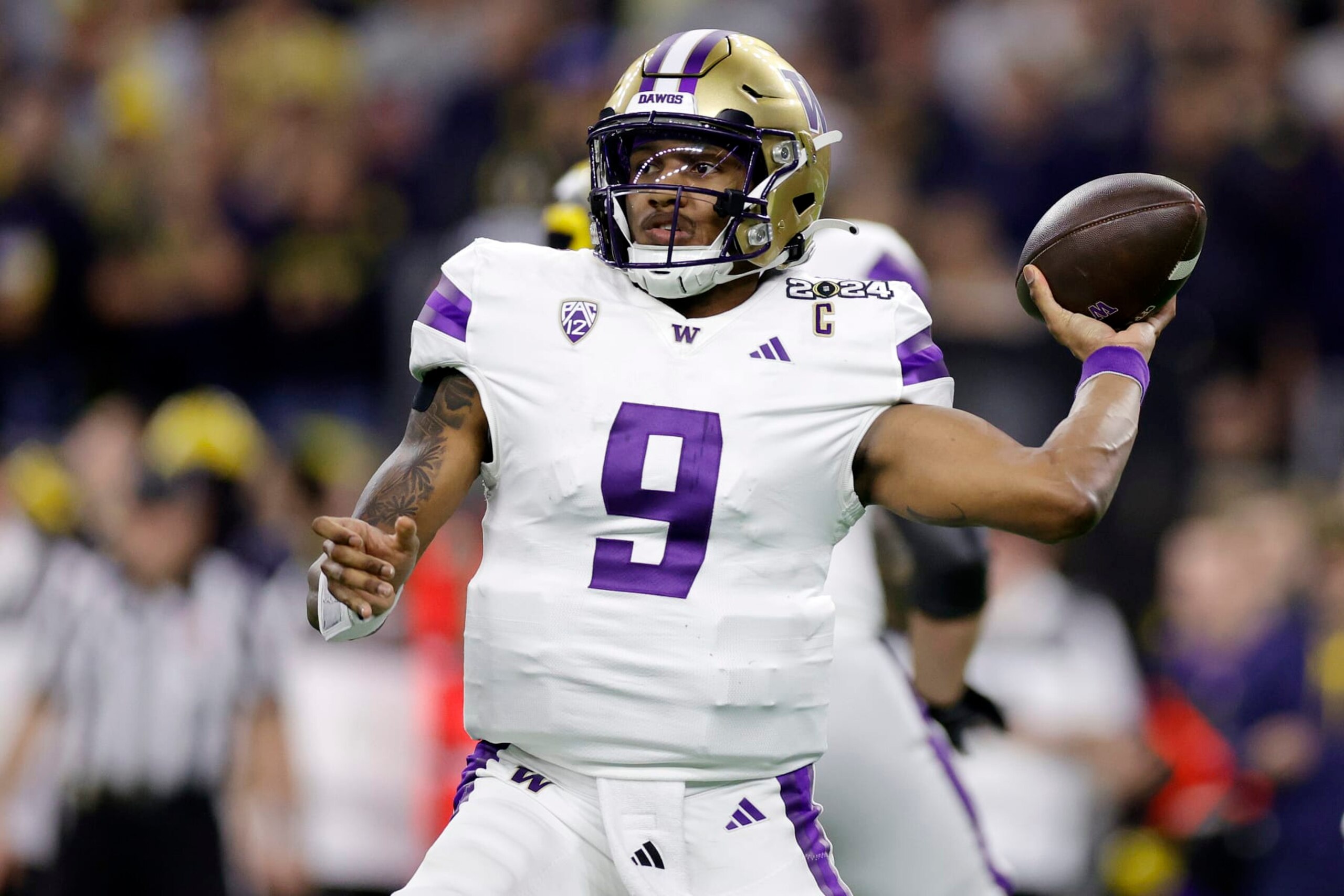 HOUSTON, TEXAS - JANUARY 08: Michael Penix Jr. #9 of the Washington Huskies throws the ball in the third quarter against the Michigan Wolverines during the 2024 CFP National Championship game at NRG Stadium on January 08, 2024 in Houston, Texas. (Photo by Carmen Mandato/Getty Images)