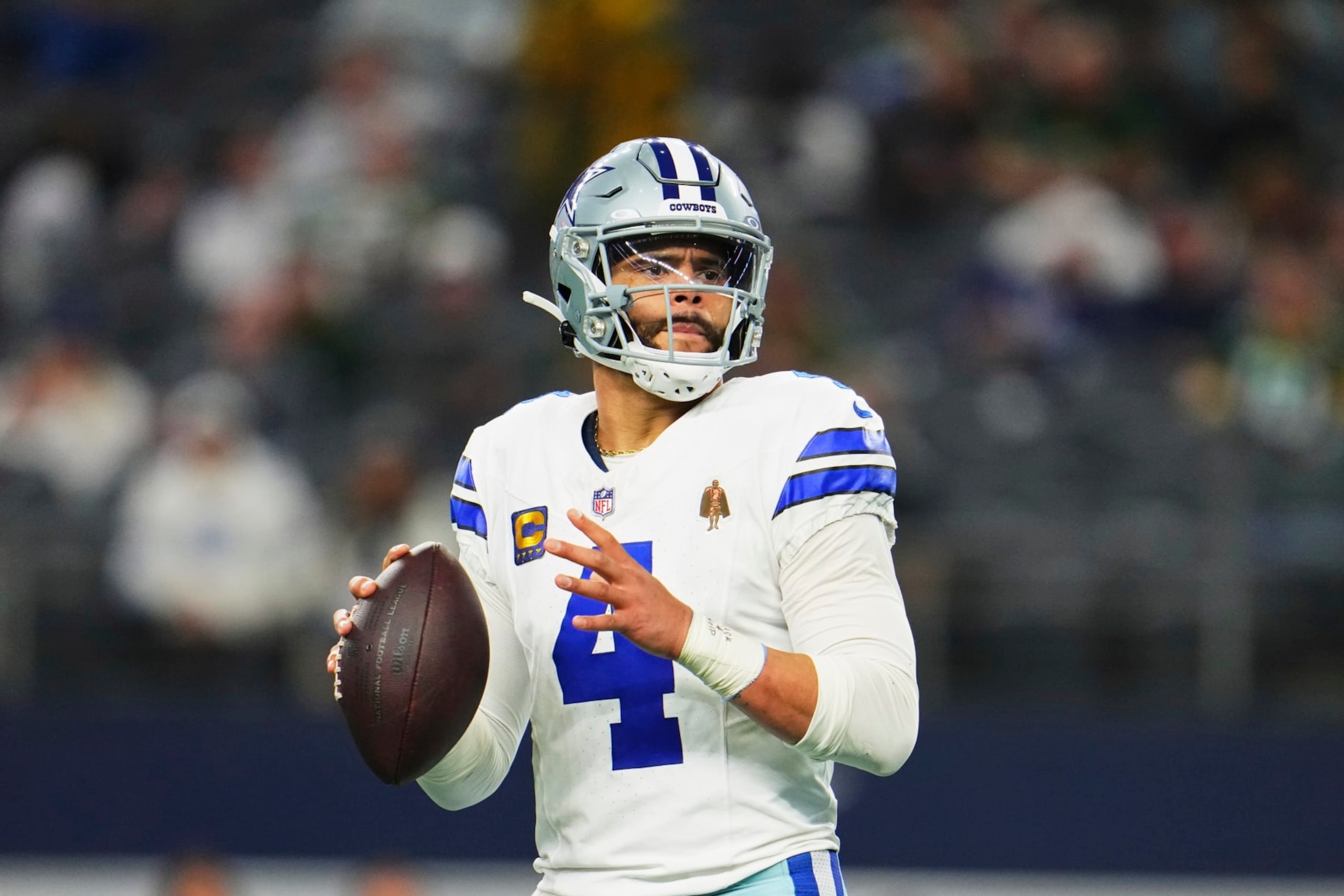 DALLAS, TX - JANUARY 14: Dak Prescott #4 of the Dallas Cowboys looks to pass against the Green Bay Packers during the second half of the NFC Wild Card playoff game at AT&T Stadium on January 14, 2024 in Dallas, Texas. (Photo by Cooper Neill/Getty Images)