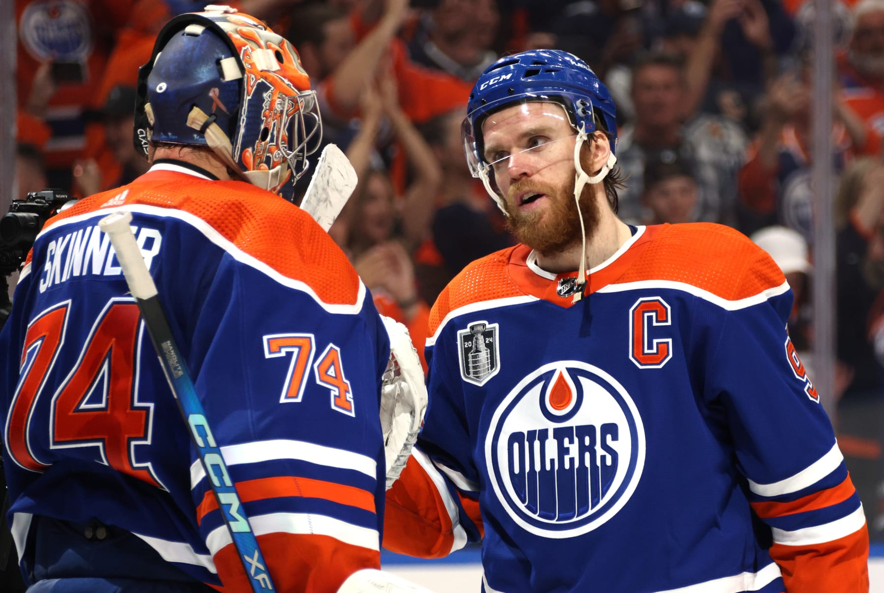 EDMONTON, ALBERTA - JUNE 21: Goaltender Stuart Skinner #74 and Connor McDavid #97 of the Edmonton Oilers celebrate after Game Six of the 2024 Stanley Cup Final between Florida Panthers and the Edmonton Oilers at Rogers Place on June 21, 2024 in Edmonton, Alberta.  (Photo by Dave Sandford/NHLI via Getty Images)