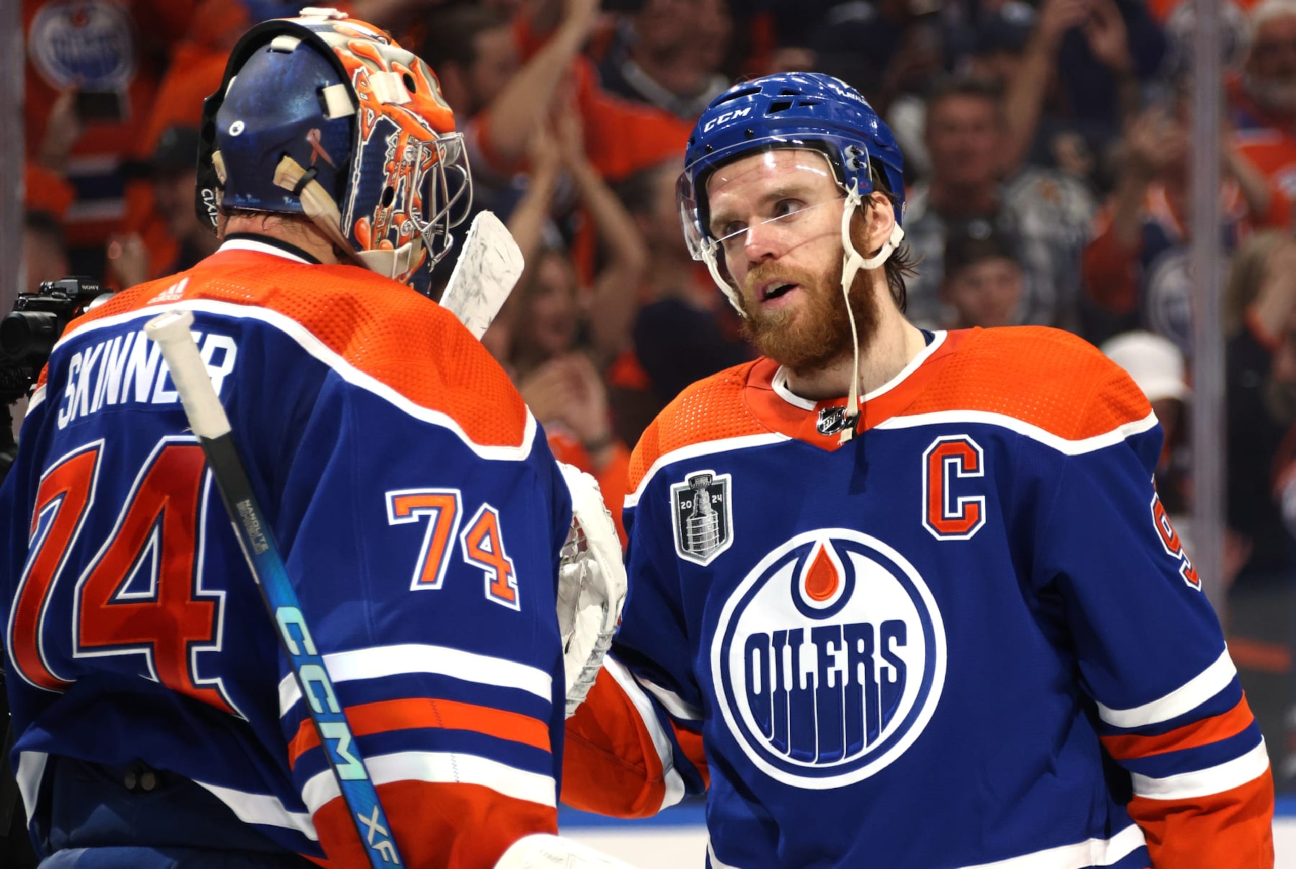 EDMONTON, ALBERTA - JUNE 21: Goaltender Stuart Skinner #74 and Connor McDavid #97 of the Edmonton Oilers celebrate after Game Six of the 2024 Stanley Cup Final between Florida Panthers and the Edmonton Oilers at Rogers Place on June 21, 2024 in Edmonton, Alberta.  (Photo by Dave Sandford/NHLI via Getty Images)