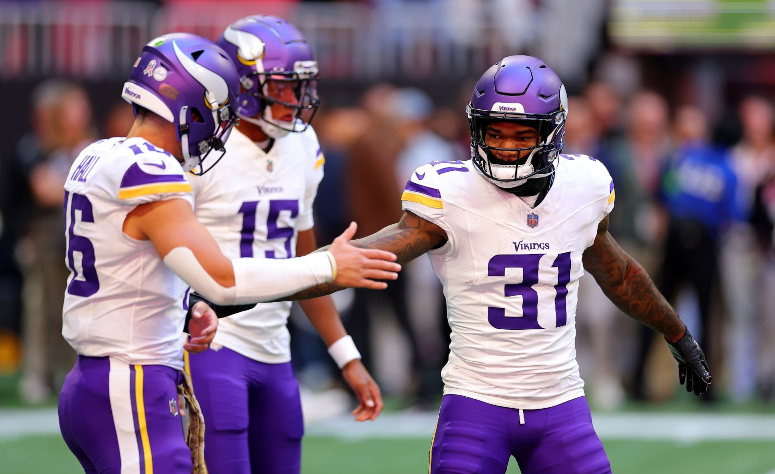 ATLANTA, GEORGIA - NOVEMBER 05: Cam Akers #31 of the Minnesota Vikings high fives Jaren Hall #16 of the Minnesota Vikings before the game against the Atlanta Falcons at Mercedes-Benz Stadium on November 05, 2023 in Atlanta, Georgia. (Photo by Kevin C. Cox/Getty Images) ATLANTA, GEORGIA - NOVEMBER 05: Cam Akers #31 of the Minnesota Vikings high fives Jaren Hall #16 of the Minnesota Vikings before the game against the Atlanta Falcons at Mercedes-Benz Stadium on November 05, 2023 in Atlanta, Georgia. (Photo by Kevin C. Cox/Getty Images)