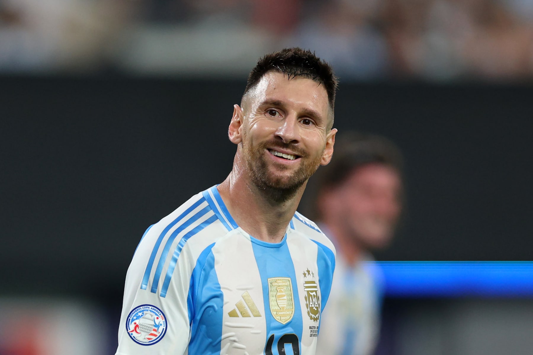 EAST RUTHERFORD, NEW JERSEY - JULY 09: Lionel Messi of Argentina smiles during the CONMEBOL Copa America 2024 semifinal match between Canada and Argentina at MetLife Stadium on July 09, 2024 in East Rutherford, New Jersey. (Photo by Elsa/Getty Images)