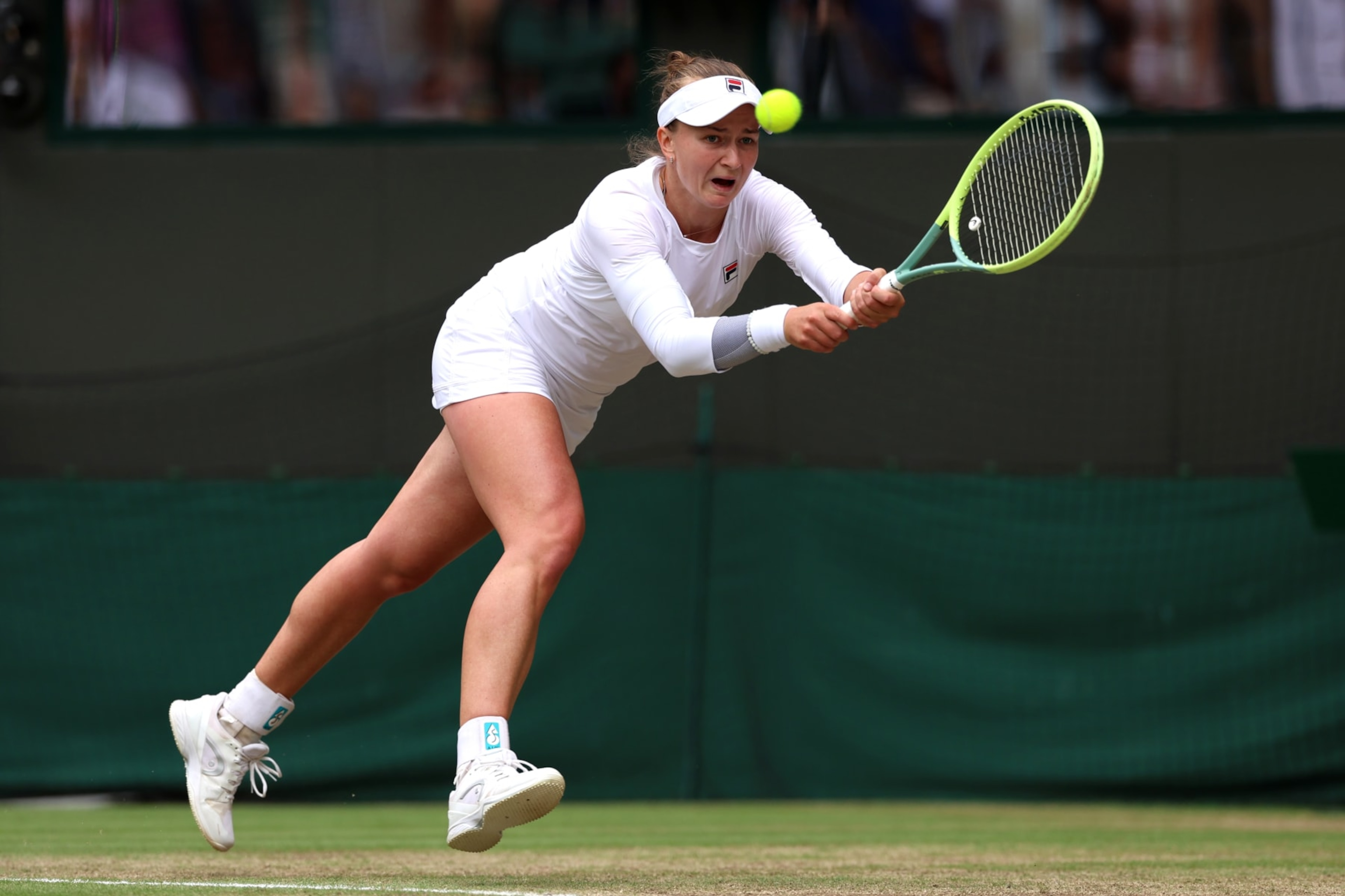 LONDON, ENGLAND - JULY 10: Barbora Krejcikova of Czechia plays a backhand against Jelena Ostapenko of Latvia in the Ladies' Singles Quarter Final match during day ten of The Championships Wimbledon 2024 at All England Lawn Tennis and Croquet Club on July 10, 2024 in London, England. (Photo by Sean M. Haffey/Getty Images) LONDON, ENGLAND - JULY 10: Barbora Krejcikova of Czechia plays a backhand against Jelena Ostapenko of Latvia in the Ladies' Singles Quarter Final match during day ten of The Championships Wimbledon 2024 at All England Lawn Tennis and Croquet Club on July 10, 2024 in London, England. (Photo by Sean M. Haffey/Getty Images)
