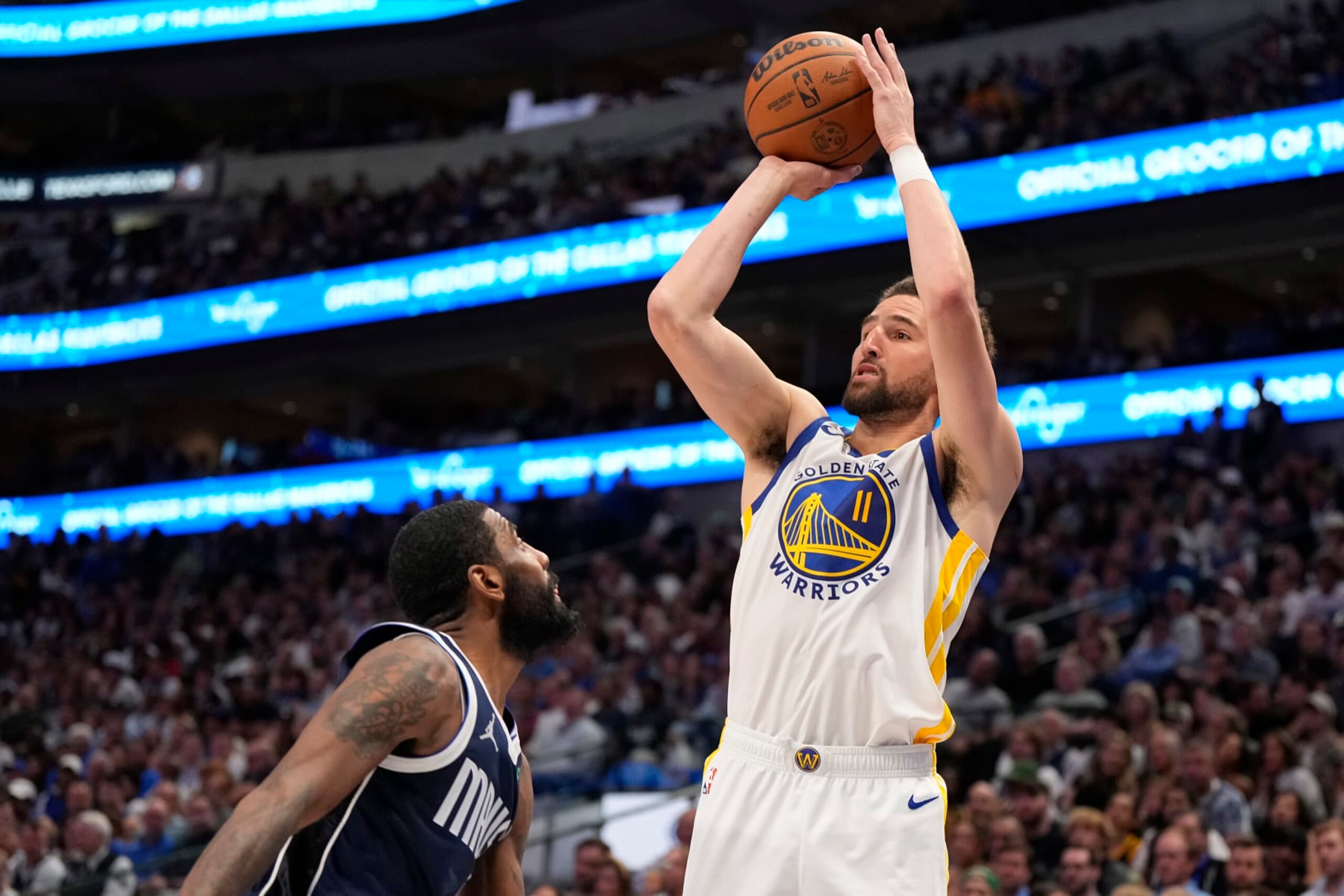 DALLAS, TEXAS - APRIL 05: Klay Thompson #11 of the Golden State Warriors shoots the ball against Kyrie Irving #11 of the Dallas Mavericks during the second half at American Airlines Center on April 05, 2024 in Dallas, Texas. NOTE TO USER: User expressly acknowledges and agrees that, by downloading and or using this photograph, User is consenting to the terms and conditions of the Getty Images License Agreement. (Photo by Sam Hodde/Getty Images)