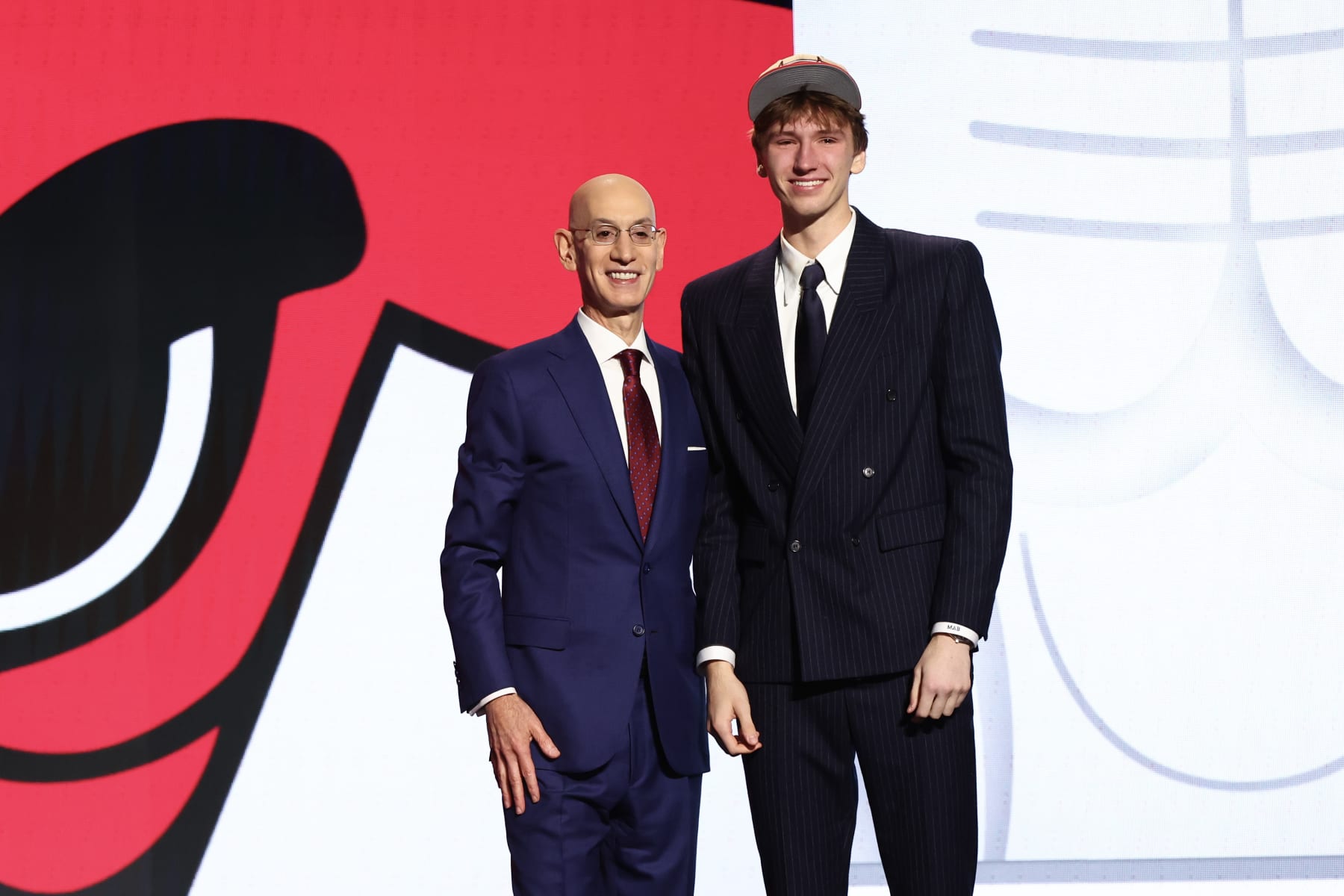 NEW YORK, NEW YORK - JUNE 26: Matas Buzelis (R) poses for a photo with NBA commissioner Adam Silver (L) after being drafted 11th overall by the Chicago Bulls during the first round of the 2024 NBA Draft at Barclays Center on June 26, 2024 in the Brooklyn borough of New York City. NOTE TO USER: User expressly acknowledges and agrees that, by downloading and or using this photograph, User is consenting to the terms and conditions of the Getty Images License Agreement. (Photo by Sarah Stier/Getty Images)
