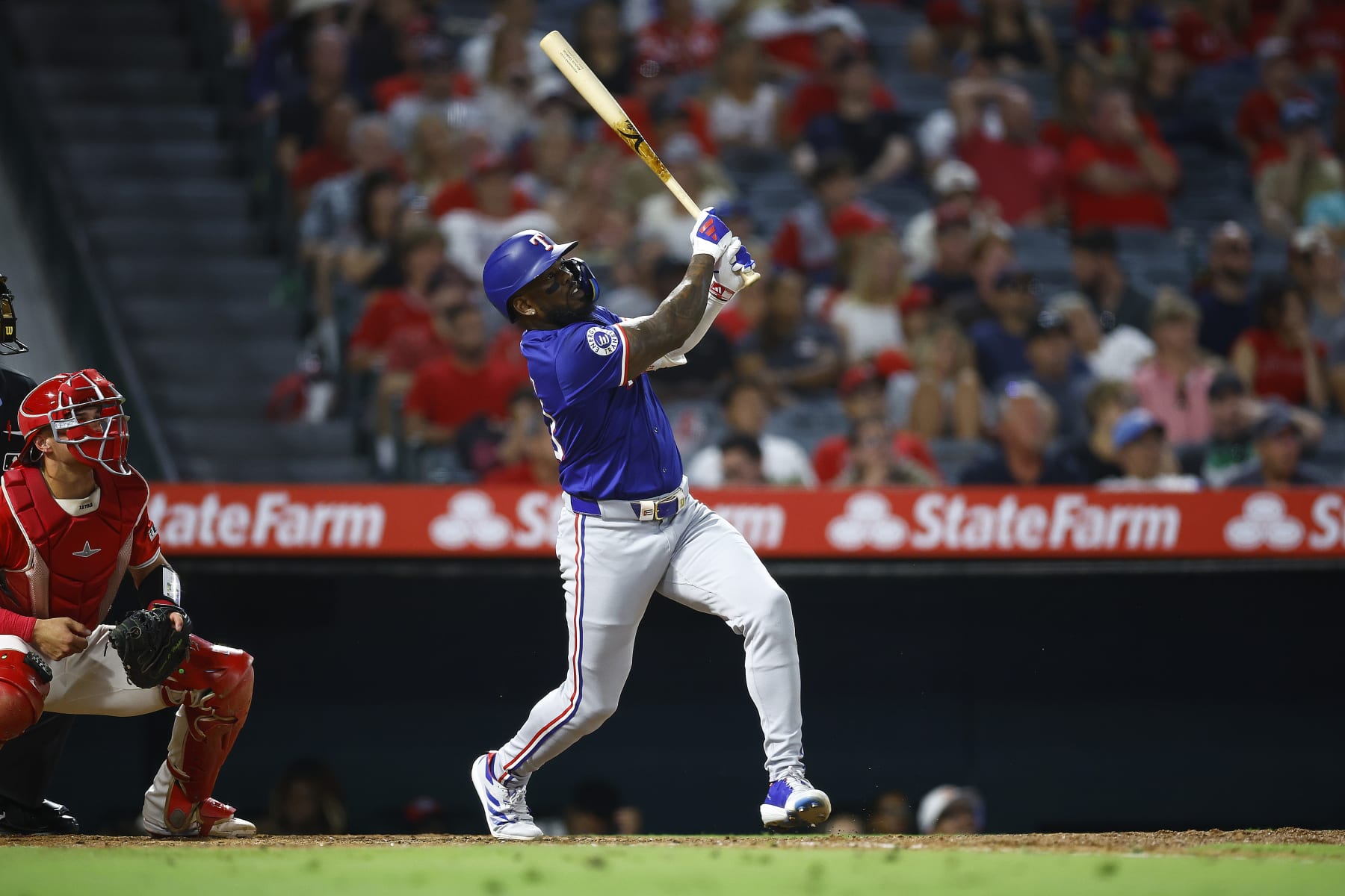 ANAHEIM, CALIFORNIA - JULY 09:  Adolis García #53 of the Texas Rangers hits a home run against the Los Angeles Angels in the eighth inning at Angel Stadium of Anaheim on July 09, 2024 in Anaheim, California. (Photo by Ronald Martinez/Getty Images)