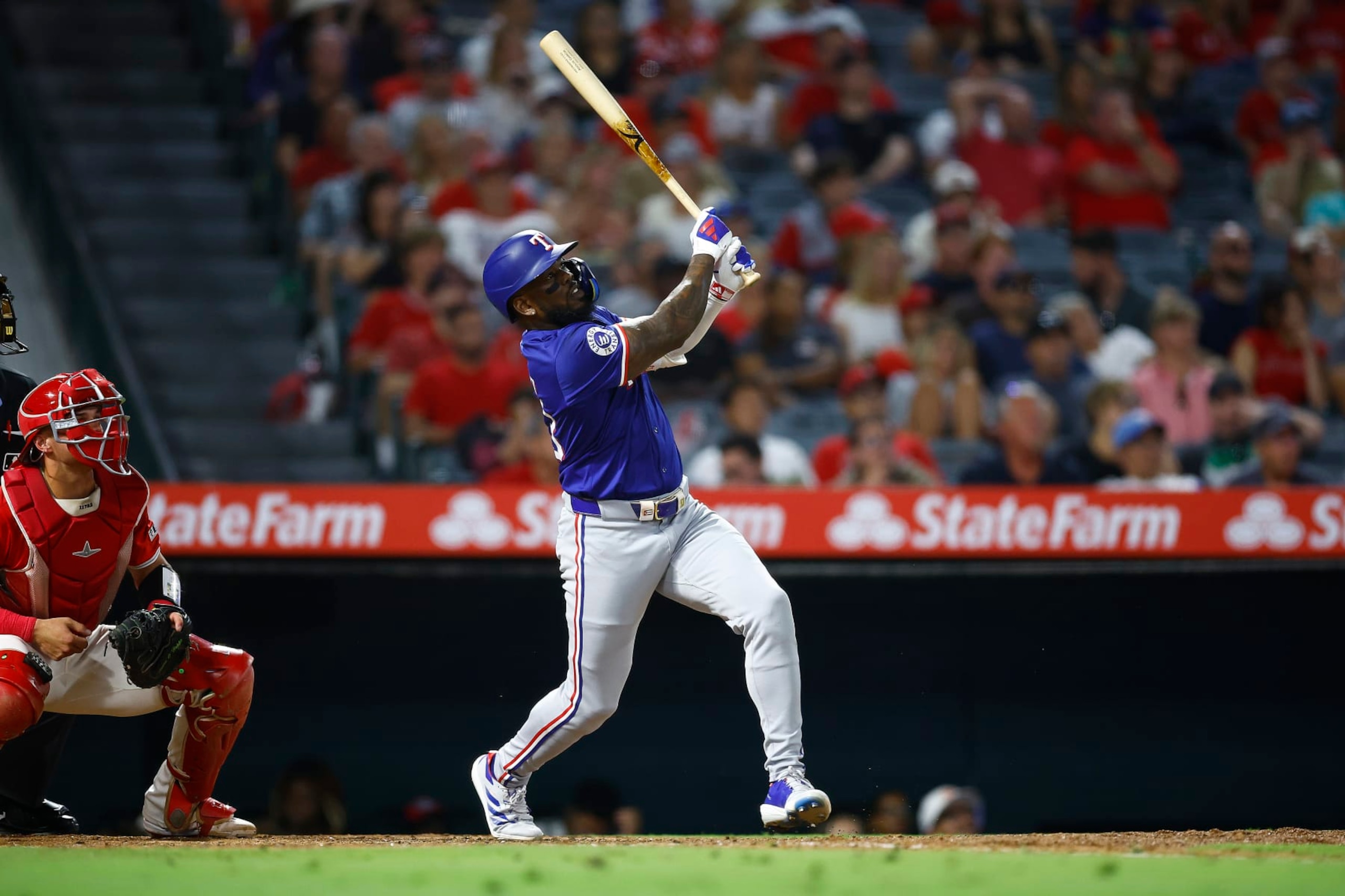 ANAHEIM, CALIFORNIA - JULY 09:  Adolis García #53 of the Texas Rangers hits a home run against the Los Angeles Angels in the eighth inning at Angel Stadium of Anaheim on July 09, 2024 in Anaheim, California. (Photo by Ronald Martinez/Getty Images)